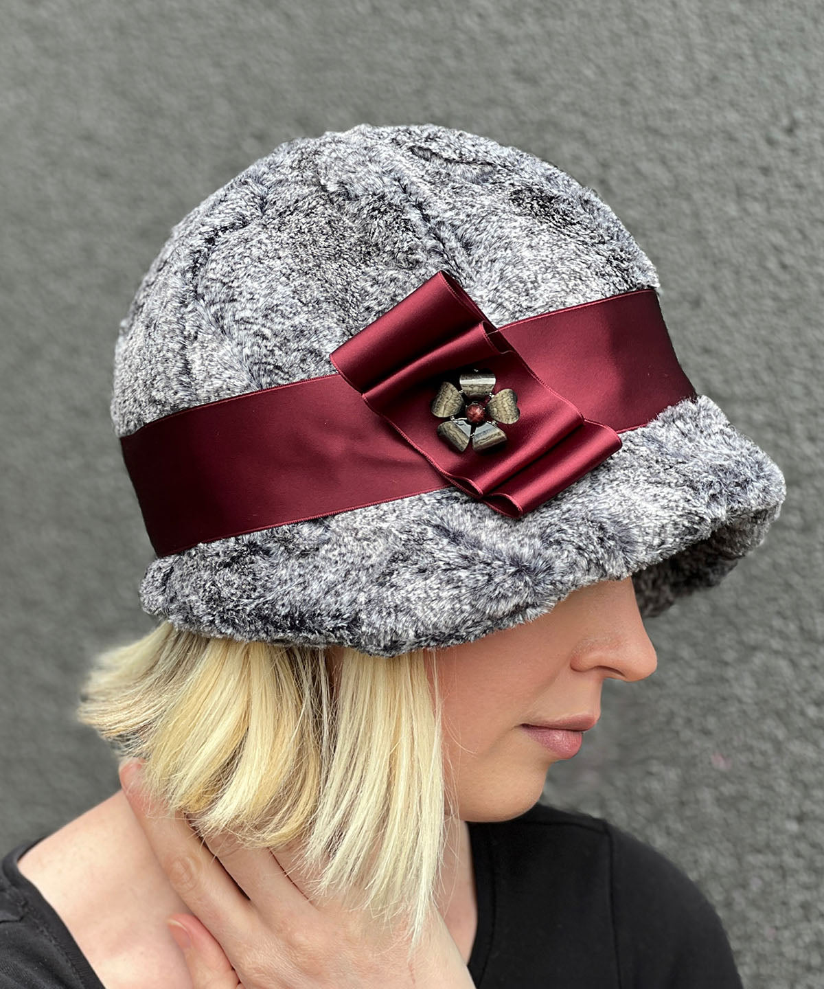 Side view of Grace Cloche Hat - Nimbus Faux Fur with Burgundy Satin Bow and Flower Button - Handmade in USA by Pandemonium Millinery
