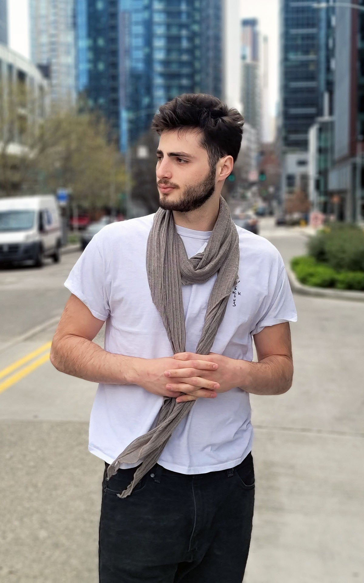 Man looking sidways standing in downtown street  wearing large Handkerchief scarf | Cotton Voile, in Earth, a  tan, taupe color| Handmade in Seattle WA | Pandemonium Millinery