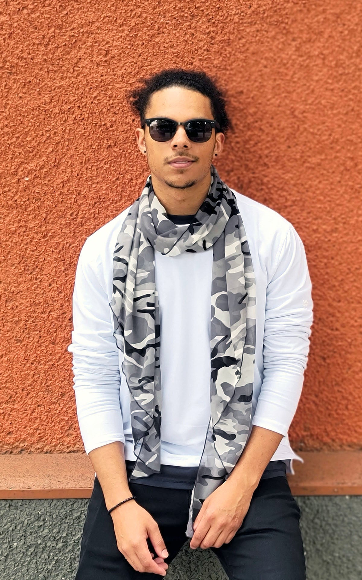 Man modeling Handkerchief Scarf in Black Ops camoflauge chiffon scarf in black, gray , and ivory with sunglasses