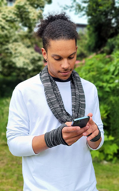 Close up of man modeling Infinity Scarf and Fingerless Gloves in Reflections Lagoon