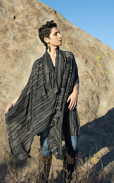 Model is wearing the Badlands Cloak Reflections in Midnight, with hood down. Leigh Young Collection