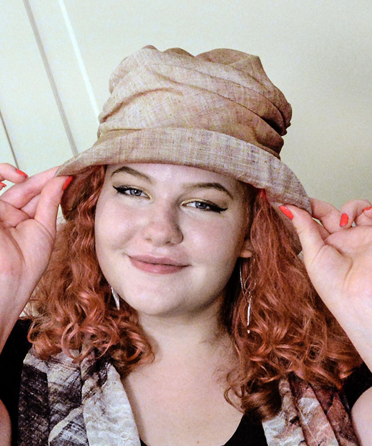 Woman wearing Cuffed Krystyne Bucket Hat in Coral Linen Handmade in Seattle WA by Pandemonium Millinery USA