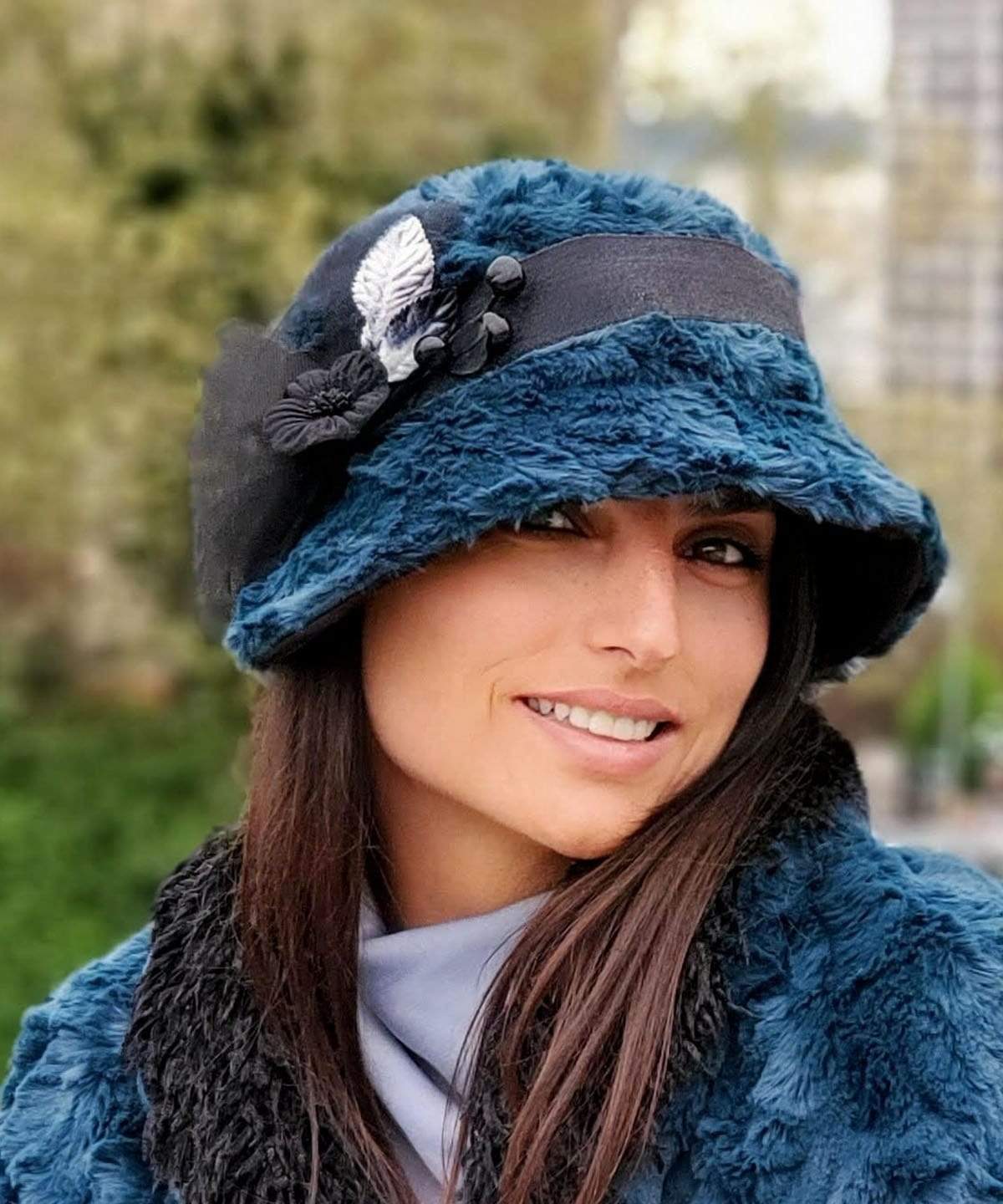 Smiling Woman wearing Abigail Hat in Blue Peacock Pond Luxury Faux Fur with Black Faux Suede under brim. Trimmed with Black Grosgrain Band| Handmade in Seattle WA| Pandemonium Millinery