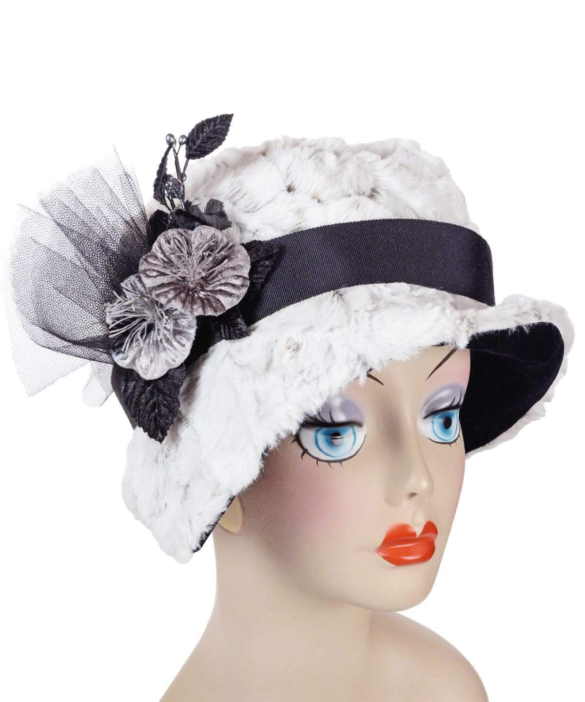 Woman wearing Abigail Hat in Winter’s Frost White Luxury Faux Fur with Black Faux Suede under rim. Trimmed with Black Grosgrain Band and Feathers| Handmade in Seattle WA| Pandemonium Millinery 