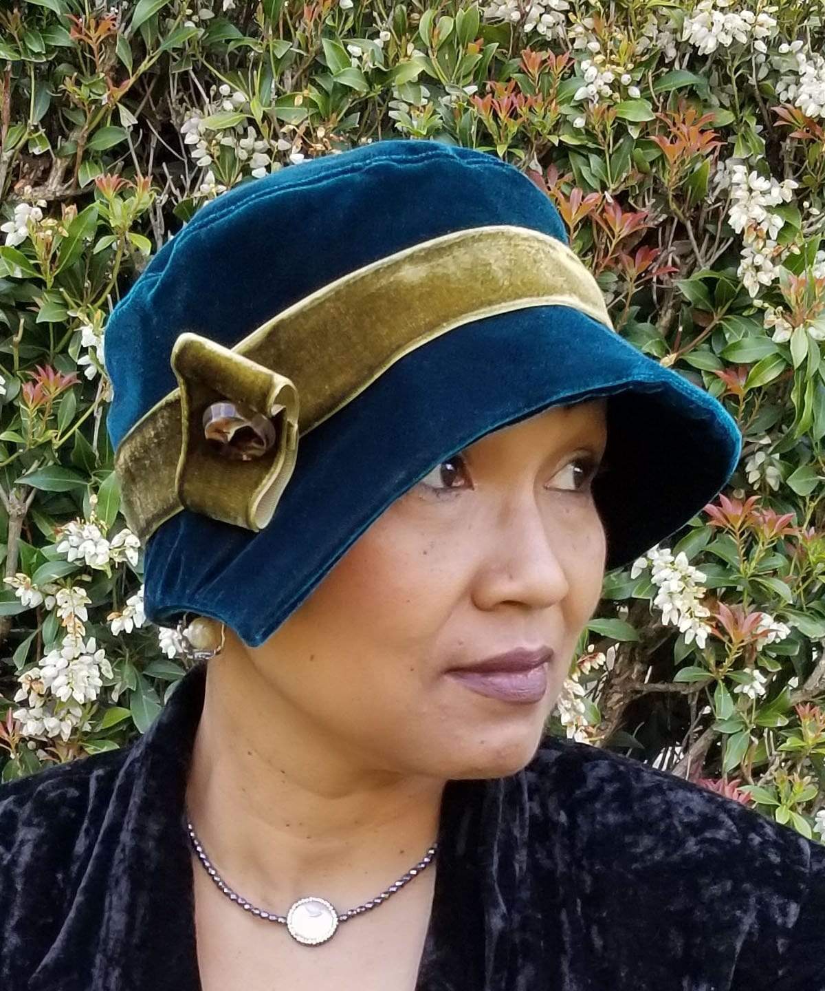Woman side view wearing Abigail Hat in Velvet in Emerald with a Midori Green Velvet band| Handmade in Seattle WA| Pandemonium Millinery
