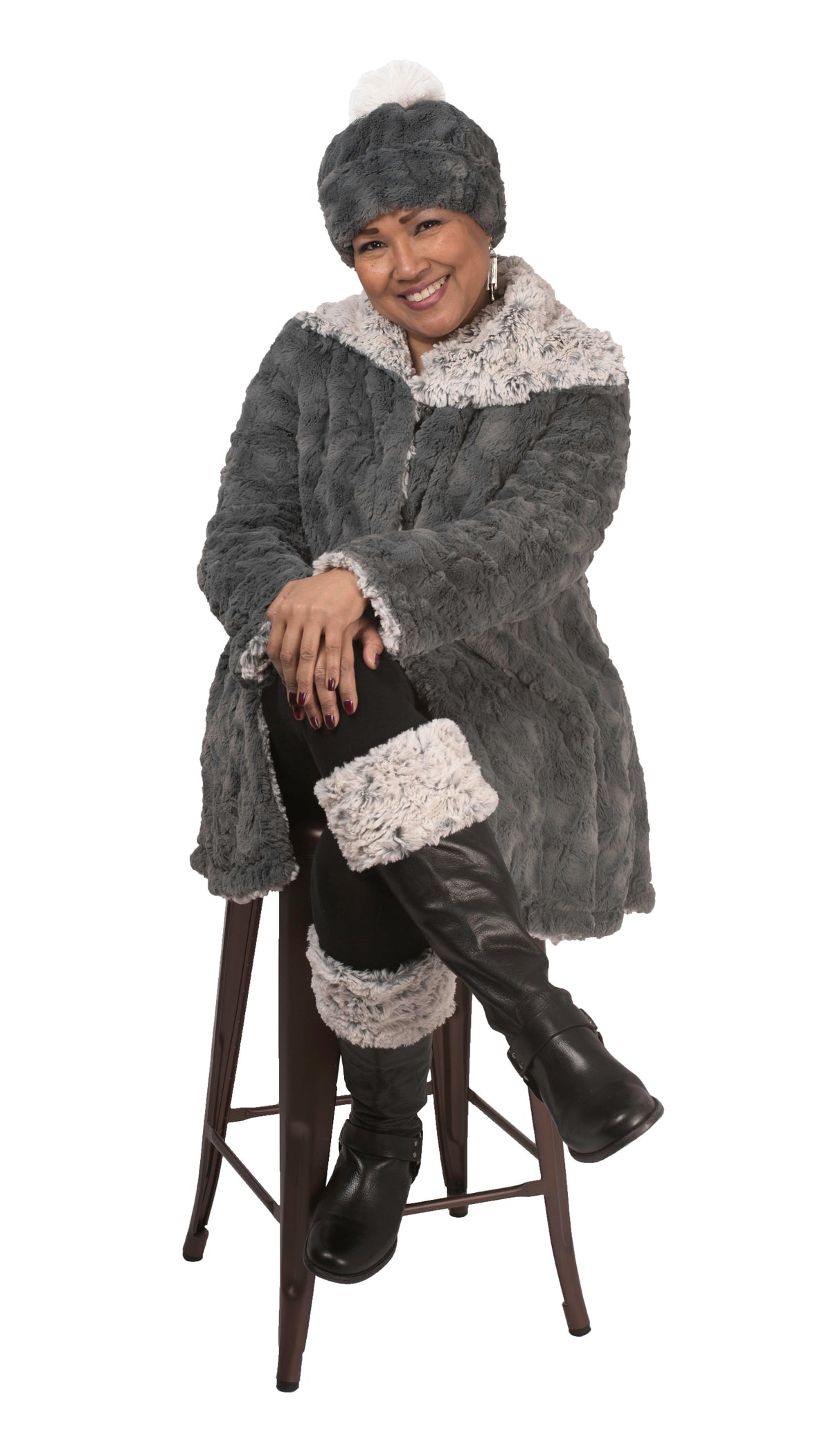 Model sitting on chair wearing a matching out of hat coat and Boot | faux fur | Handmade by Pandemonium Millinery Seattle, WA USA