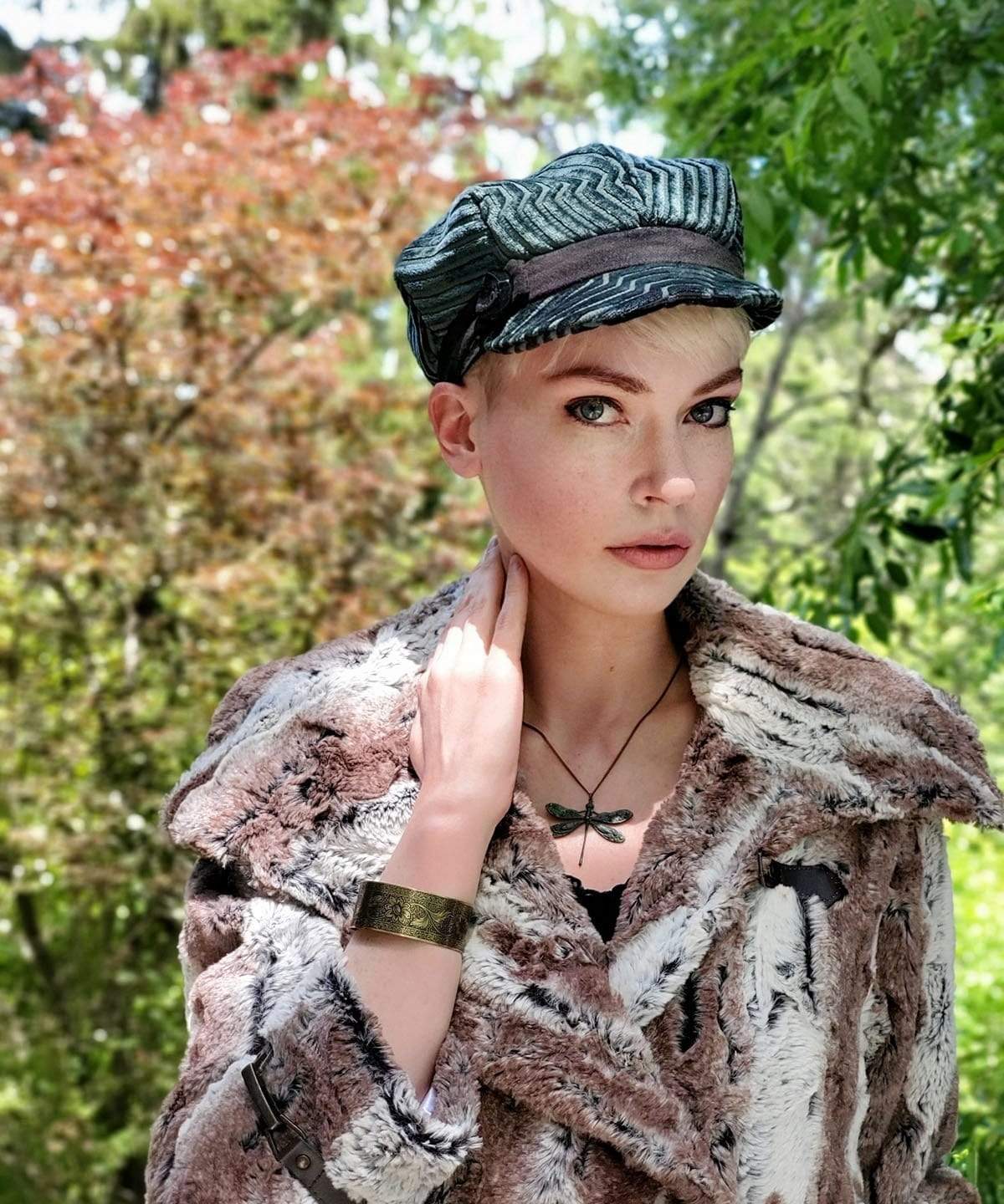 Model in a Valerie Newsboy style cap features the Dietrich Coat | Birch Brown and Ivory Faux Fur Pea Coat | Featuring Buckle Clasps | Handmade in Seattle, WA | Pandemonium Millinery
