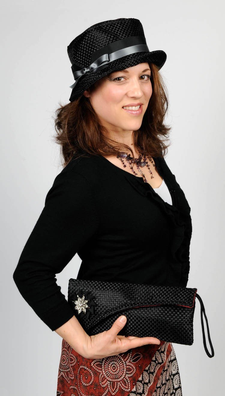 woman holding Envelope Clutch with Grosgrain Detail and matching hat - Interconnected in Black Upholstery Fabric Handbag Pandemonium Millinery