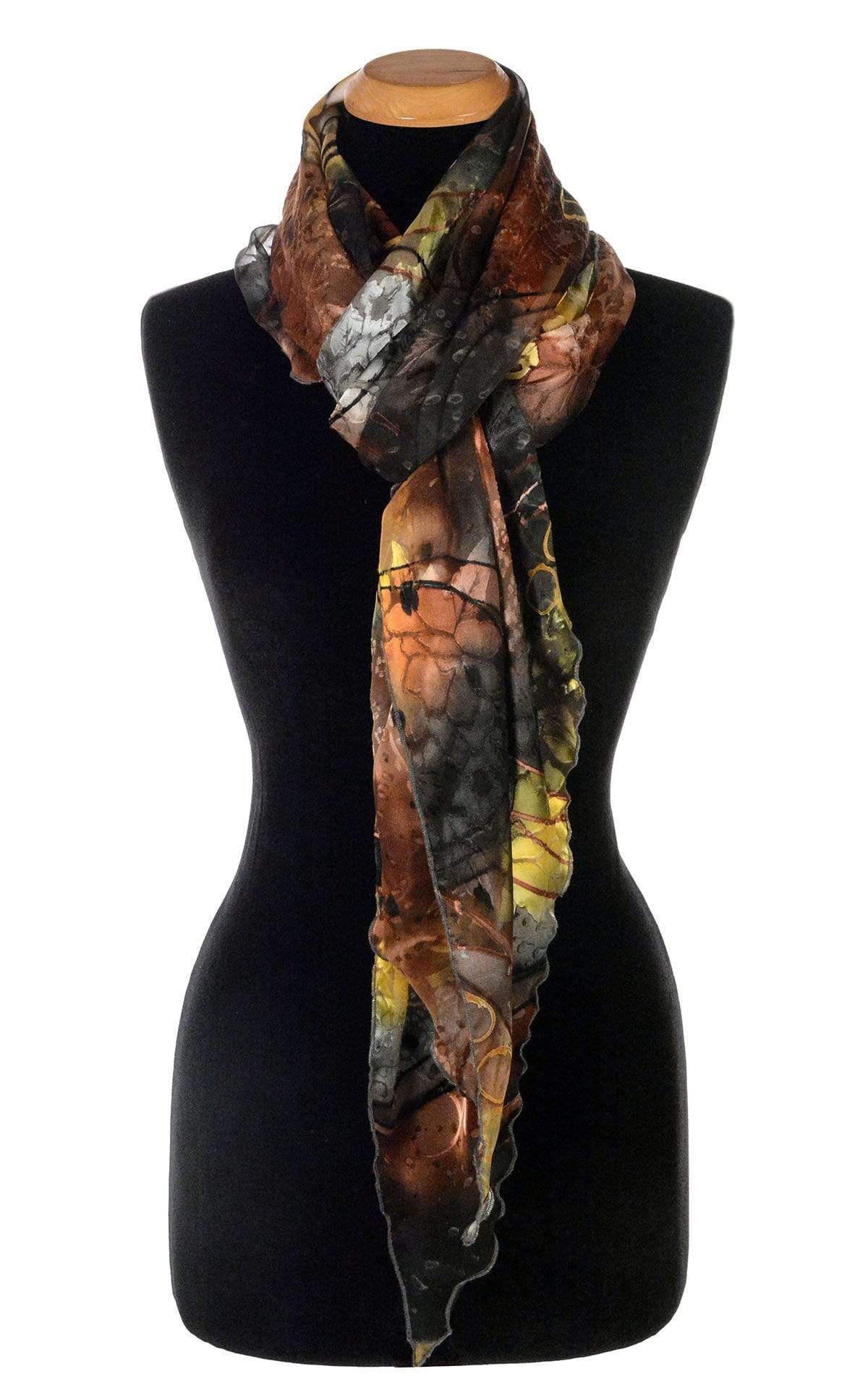 Women’s Large Handkerchief Scarf, Wrap in hand-painted silk on a mannequin shown in half loop | Garden Path in Tiger Lily black, green, rust, yellow, and Gray | Handmade in Seattle WA | Pandemonium Millinery