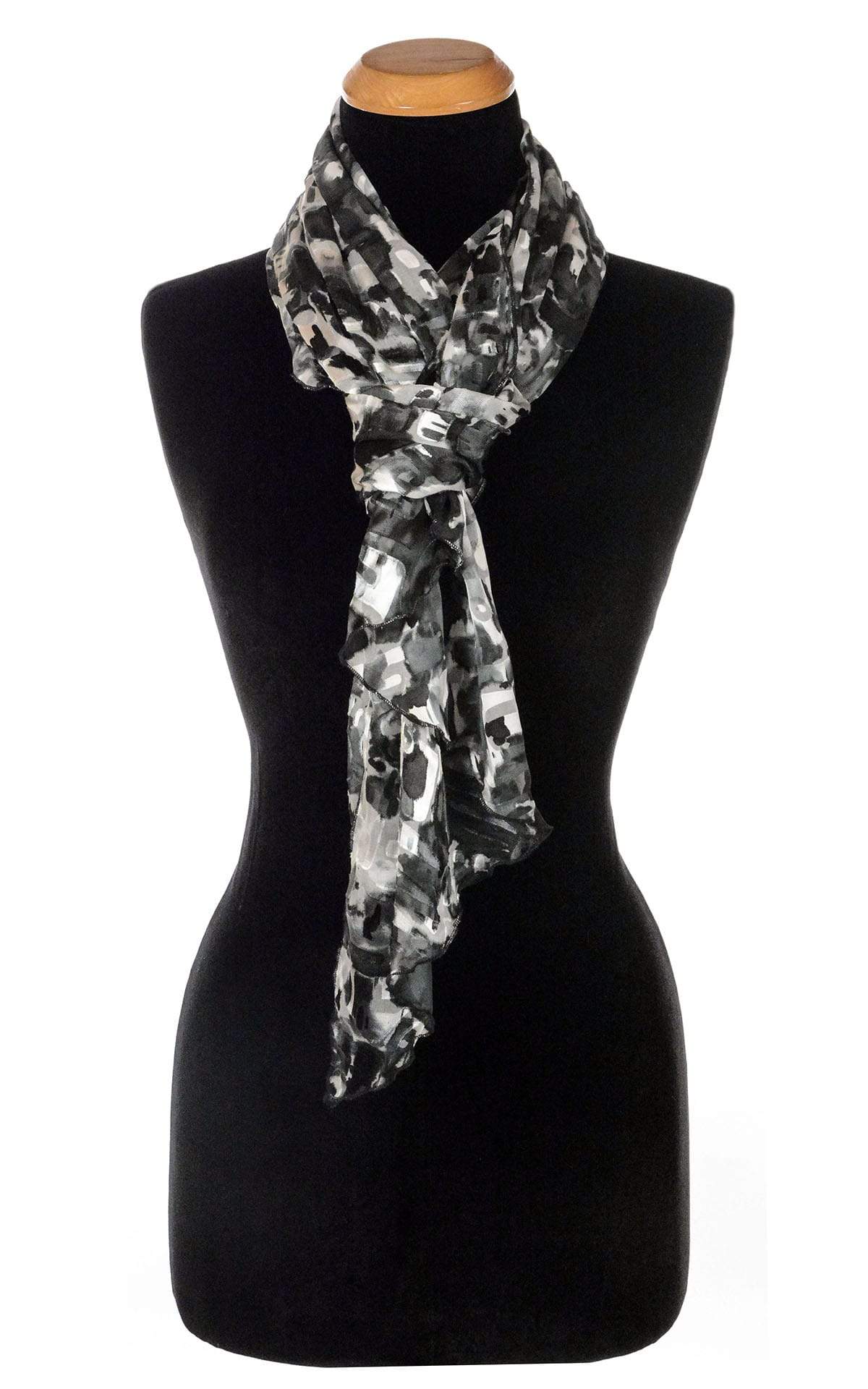 Women’s Large Handkerchief Scarf, Wrap in hand-painted silk on a mannequin shown in half loop | Garden Path in Sand Dollar  black, Gray, and Ivory print | Handmade in Seattle WA | Pandemonium Millinery