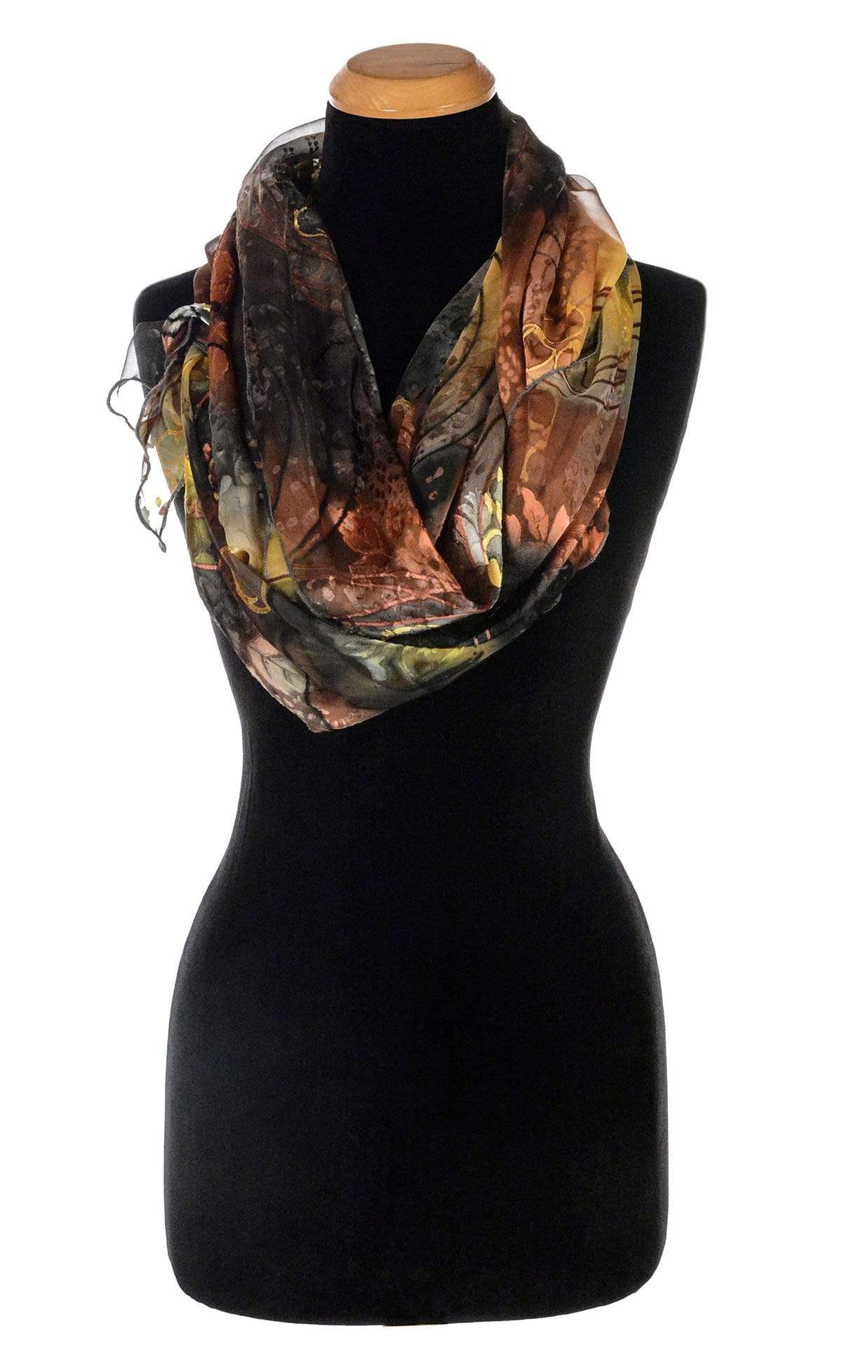 Women’s Large Handkerchief Scarf, Wrap in hand-painted silk on a mannequin shown wrapped twice | Garden Path in Tiger Lily black, green, rust, yellow, and Gray | Handmade in Seattle WA | Pandemonium Millinery