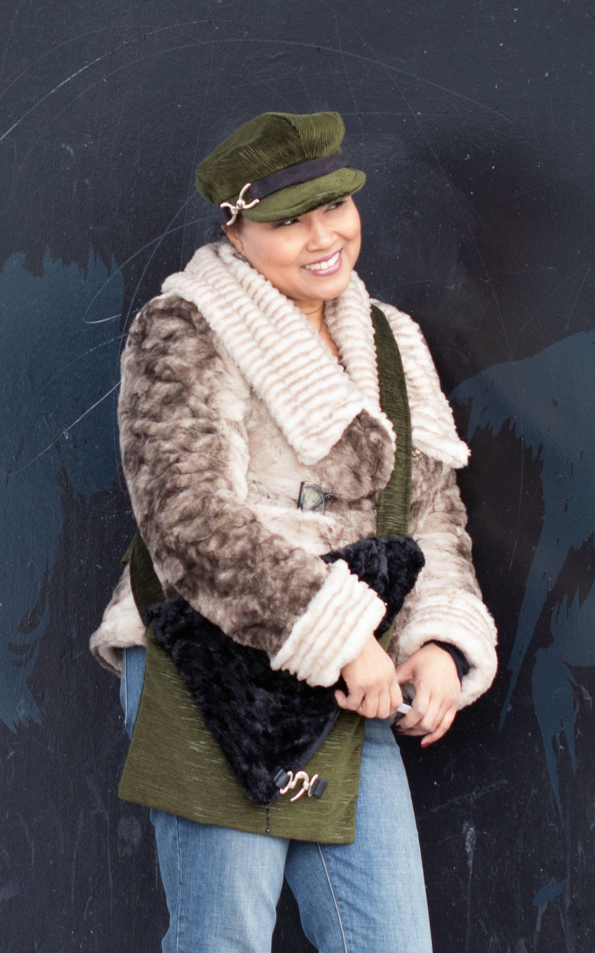 Woman in faux fur coat with Naples Messenger Bag and matching Valerie Cap | Cohen in Olive Green with Cuddly Black Faux Fur Flap | handmade in Seattle WA by Pandemonium Millinery USA