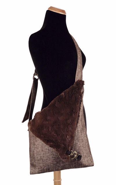 Naples Messenger Bag hanging off of mannequin | Liam in Gold with Cuddly Chocolate Faux Fur Flap | handmade in Seattle WA by Pandemonium Millinery USA