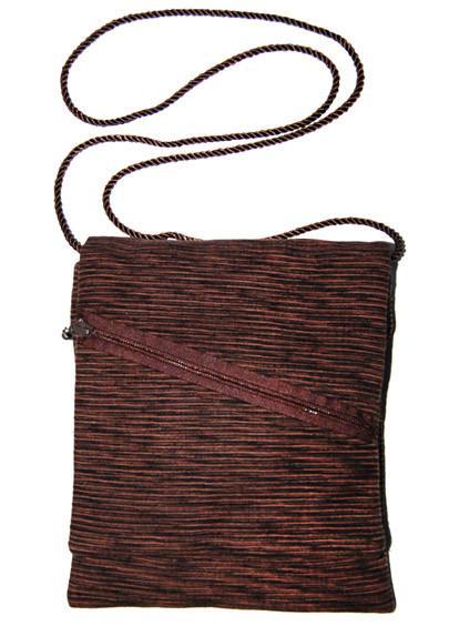 Woman modeling a Prague Handbag | Sonora Upholstrey Dark Brown Upholstery with Brown Cord Strap featuring Brown Outside  Zipper  | Handmade by Pandemonium Seattle USA |