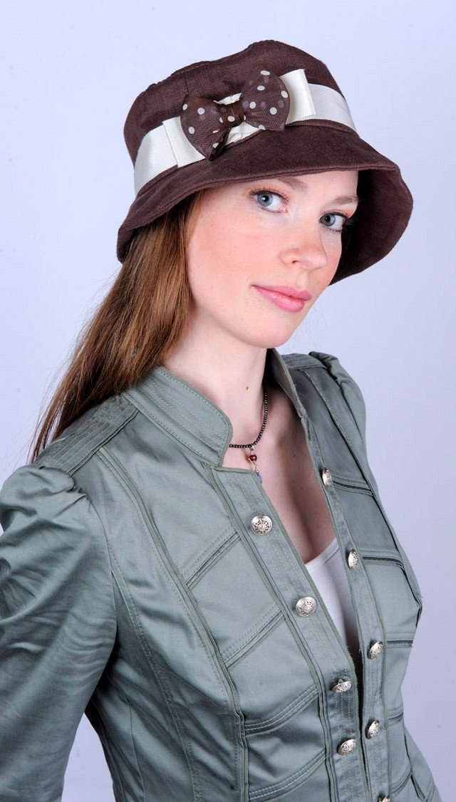 Model wearing Samantha Hat Linen in Chocolate | Cream Band with Brown Polka Bow Brooch | Handmade By Pandemonium Millinery | Seattle WA