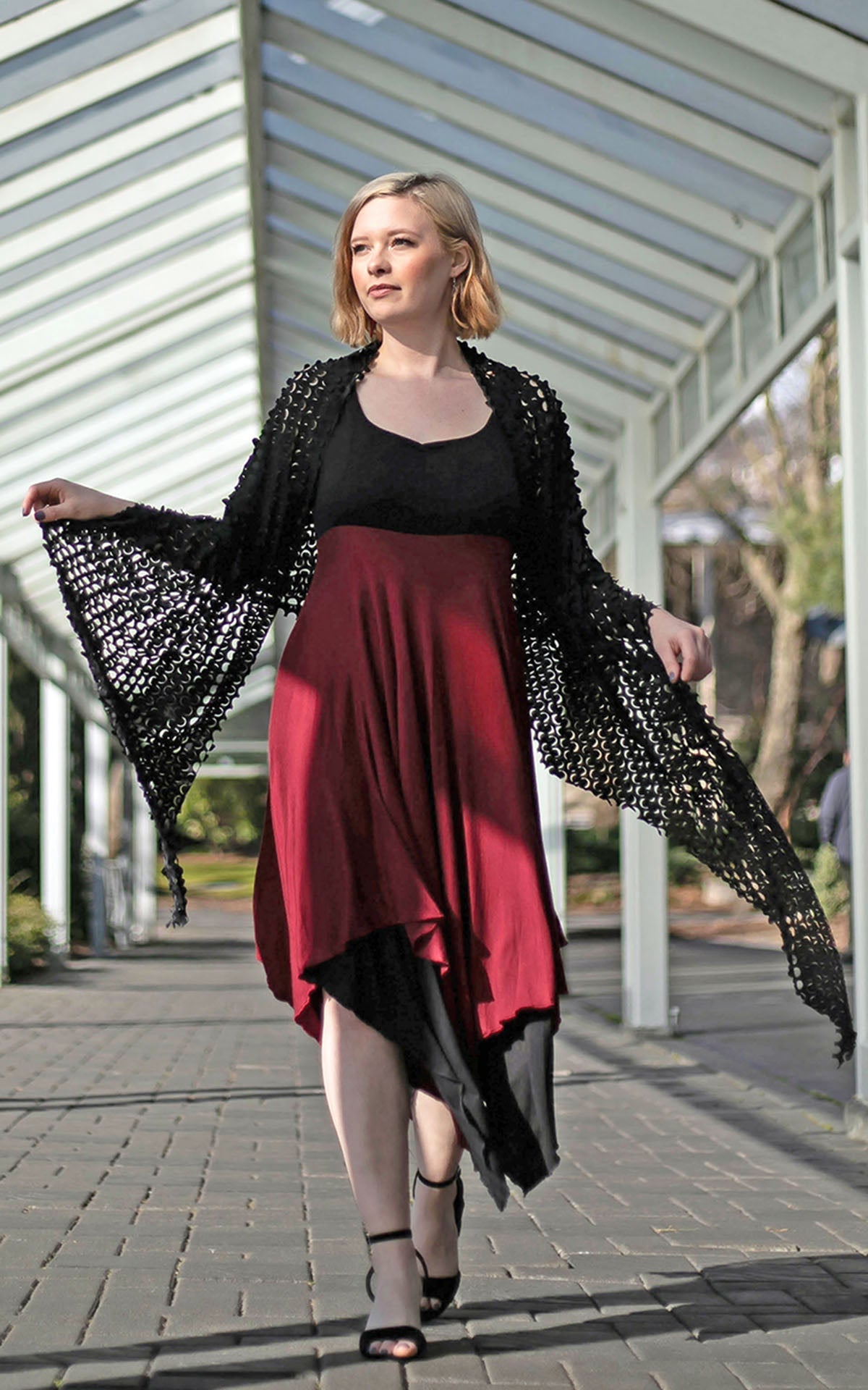 Model walking in Black and Red Jersey Knit Dress