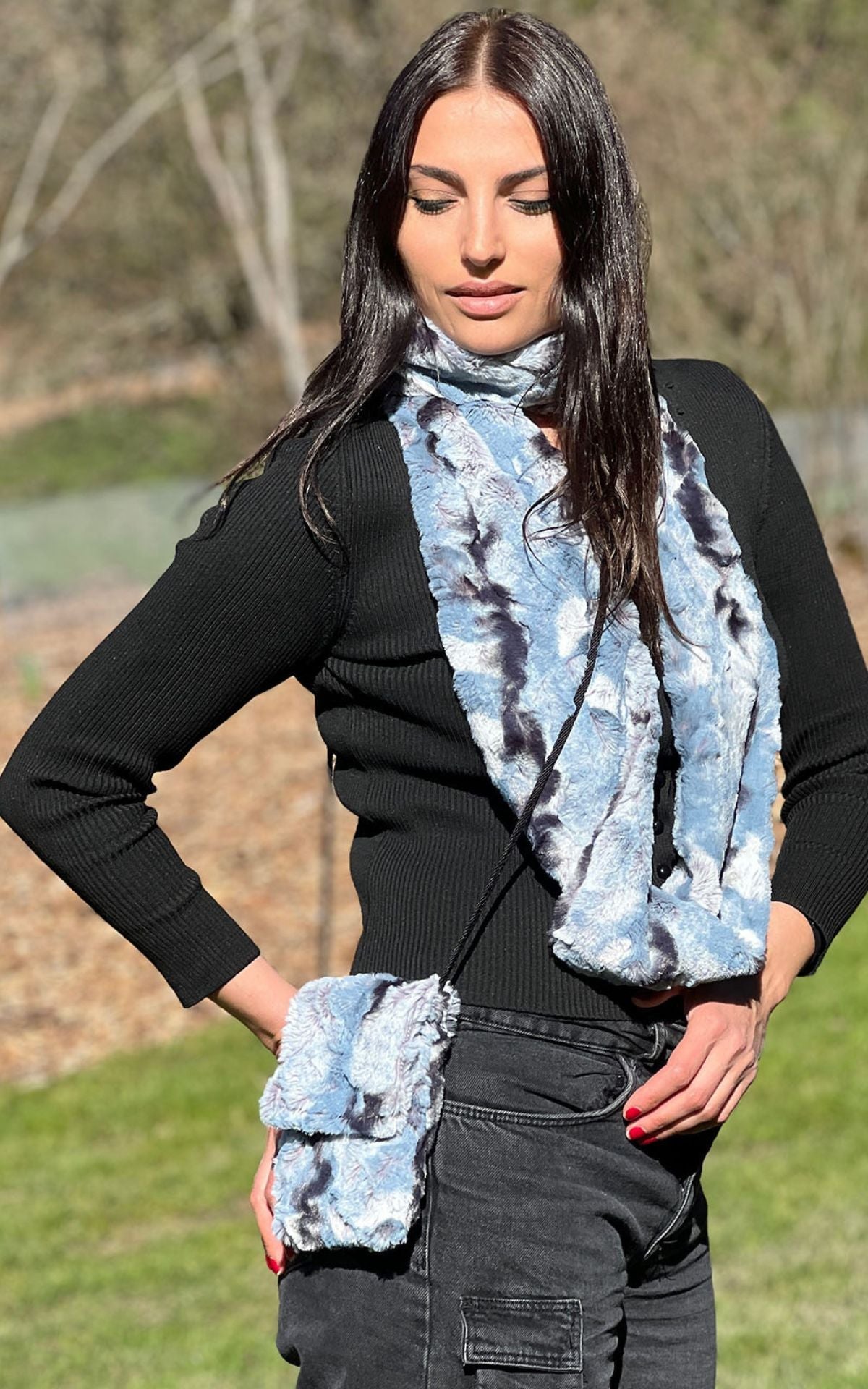 Woman wearing a Cell Phone Purse in Rainier Sky Faux Fur.