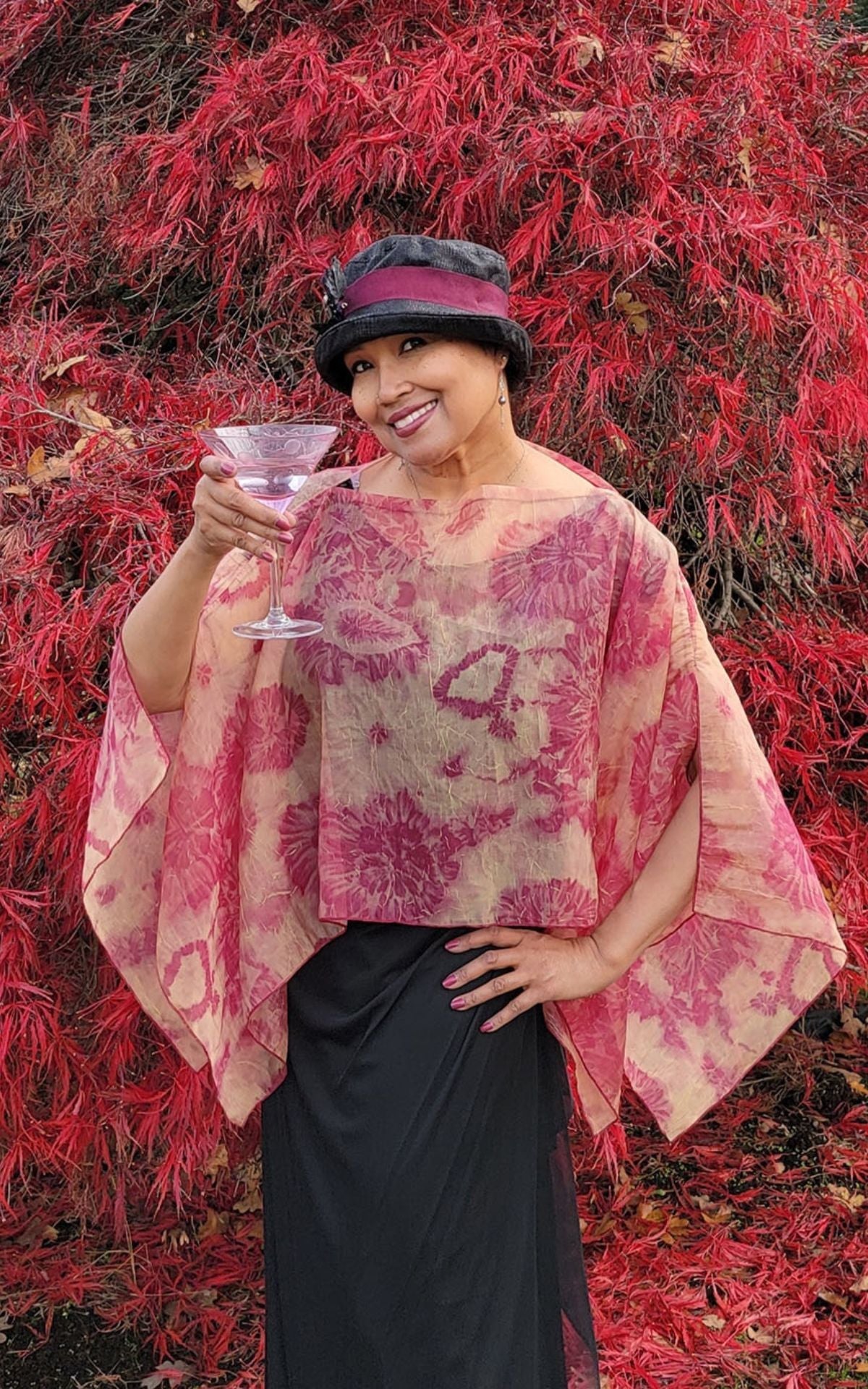 Woman wearing Coastal Garden Coral Poncho.
