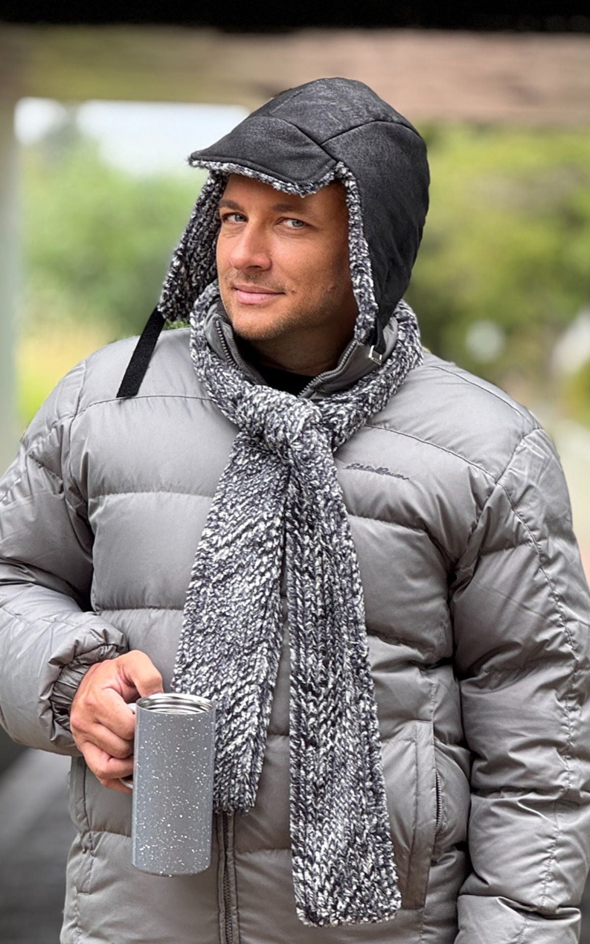 Man wearing the Aviator Hat in Vegan Leather Noir Black with Cozy Cable lining.