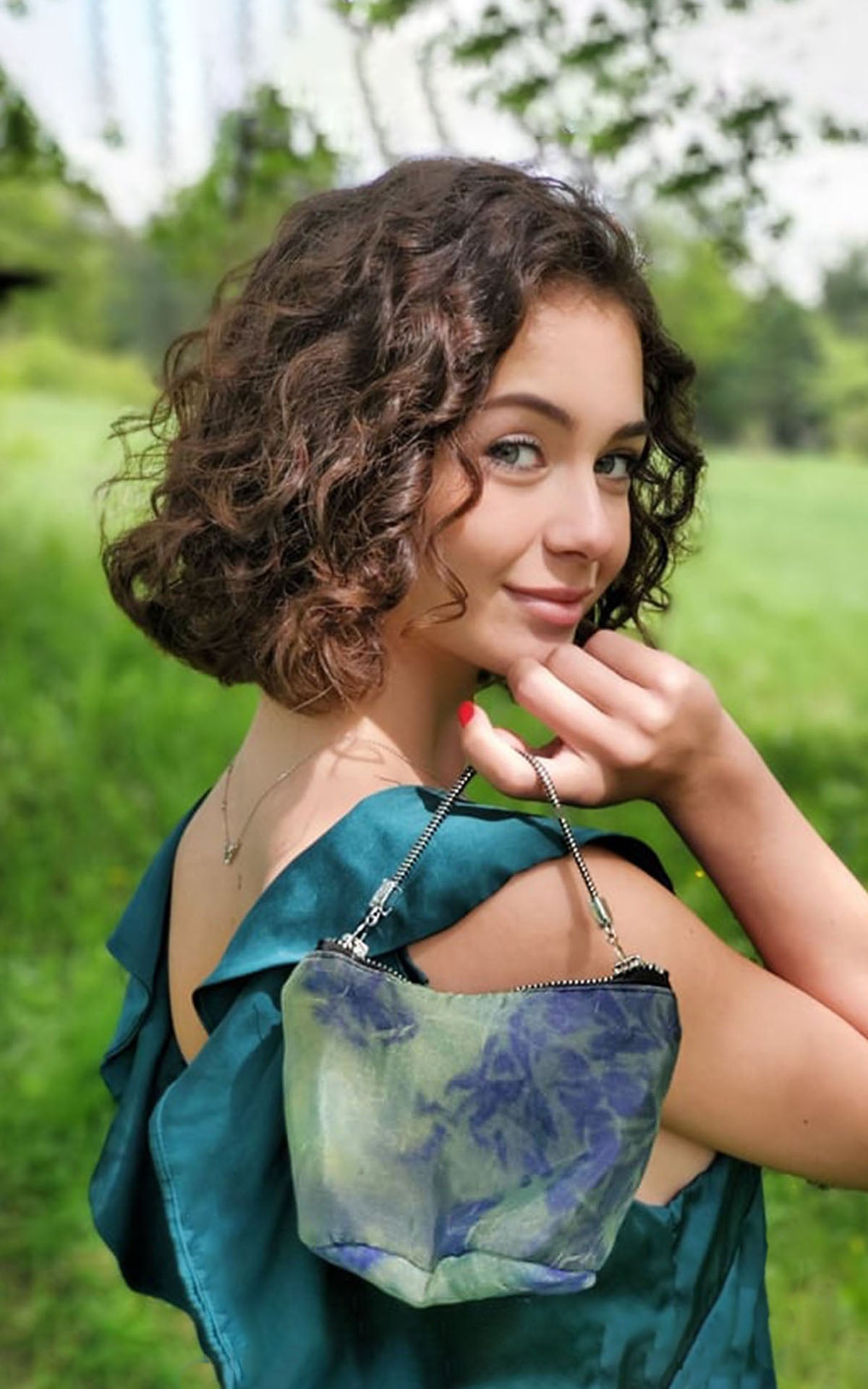 Model holding Ibiza Reticule Purse in Blue/Green Organdy