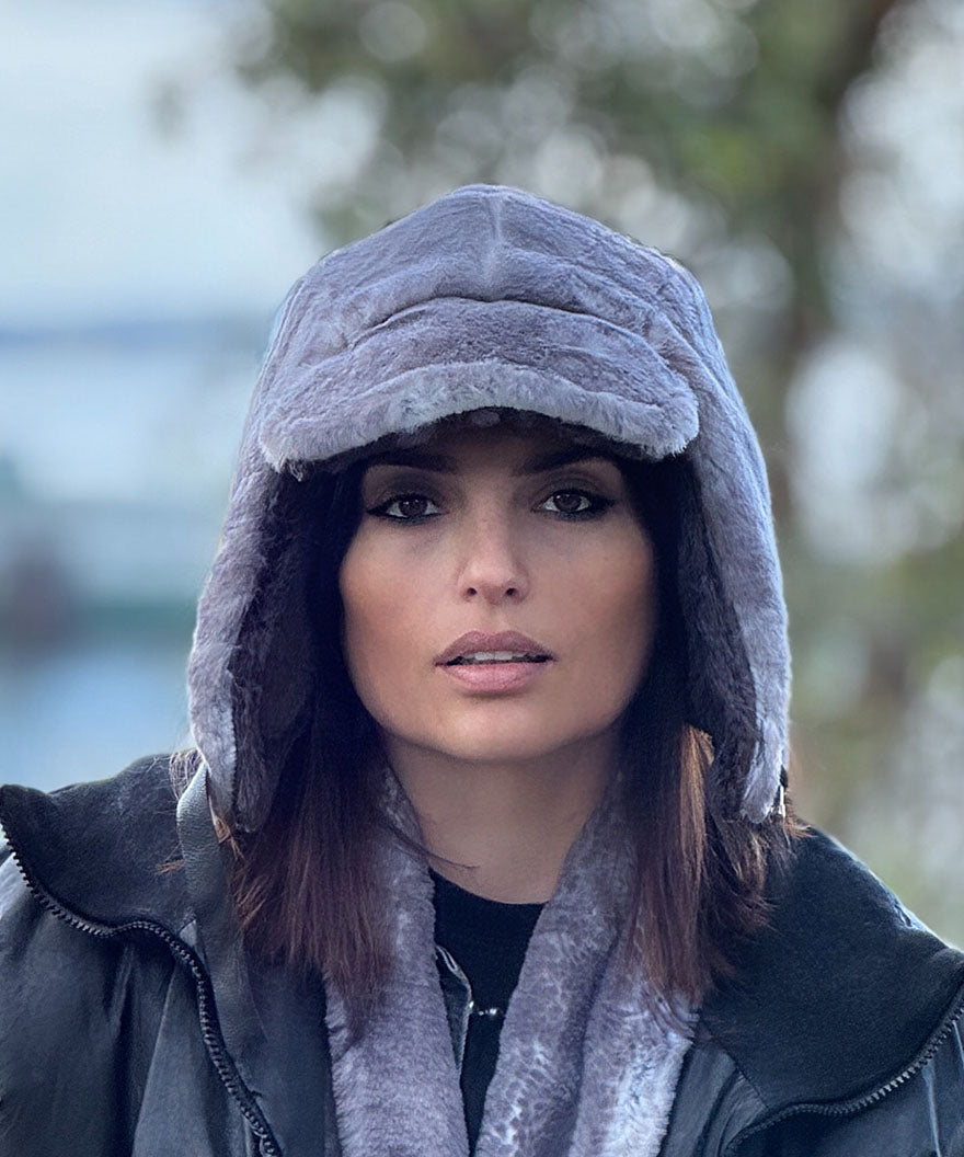 Front view of a woman wearing the Aviator hat in Olympic Fog Faux Fur. Handmade in Seattle, WA , USA by Pandemonium Millinery
