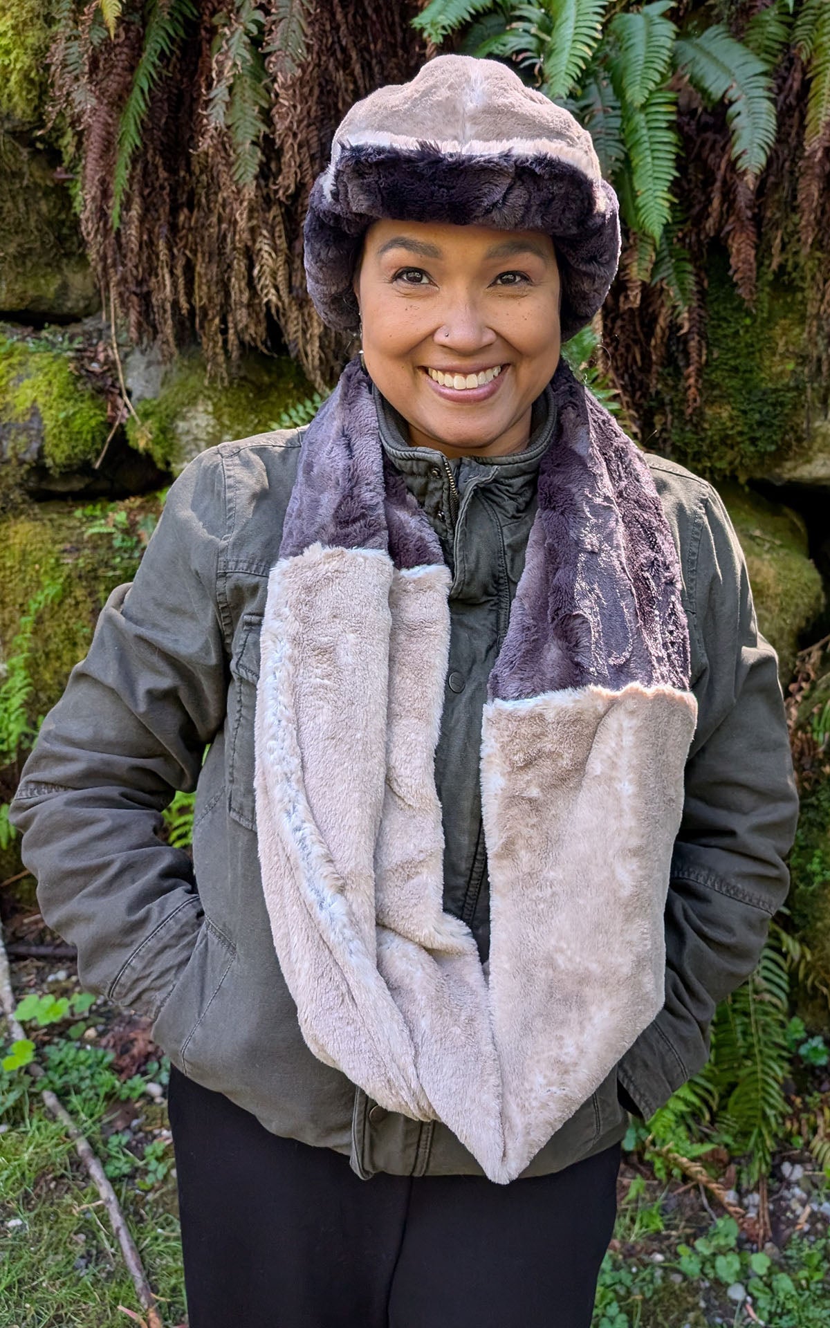 Woman wearing the Two-Tone Infinity Scarf in Coastal Plush Golden Bluff and Espresson Bean Faux Fur, with a matching Aviator Hat. Made in Seattle, WA, USA by Pandemonium Seattle.