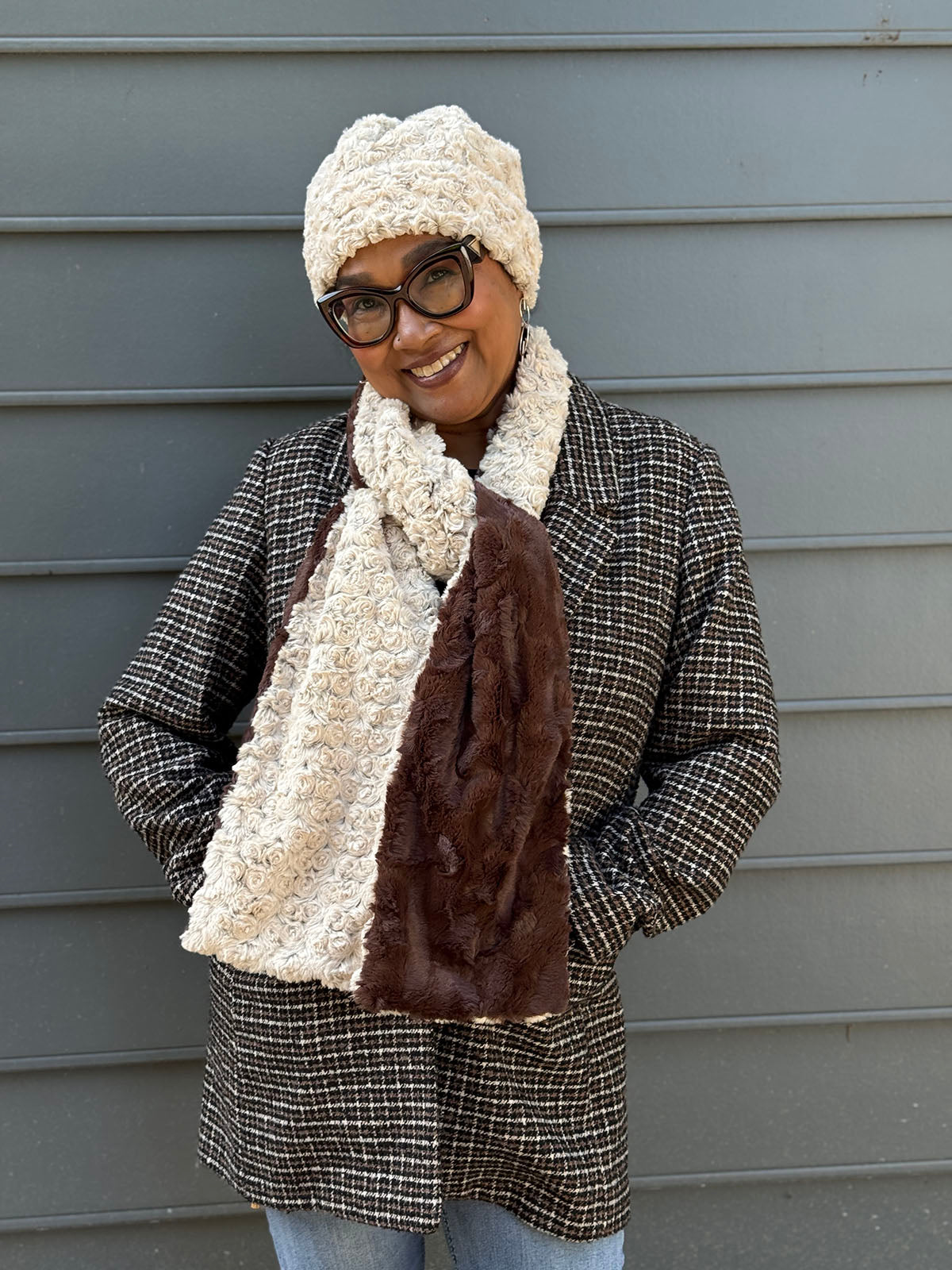 Woman wearing the Classic Two-Tone Scarf in Rosebud Brown and Cuddly Chocolate. Also wearing the matching Beanie Hat in Rosebud Brown. Made in Seattle, WA, USA by Pandemonium Seattle.