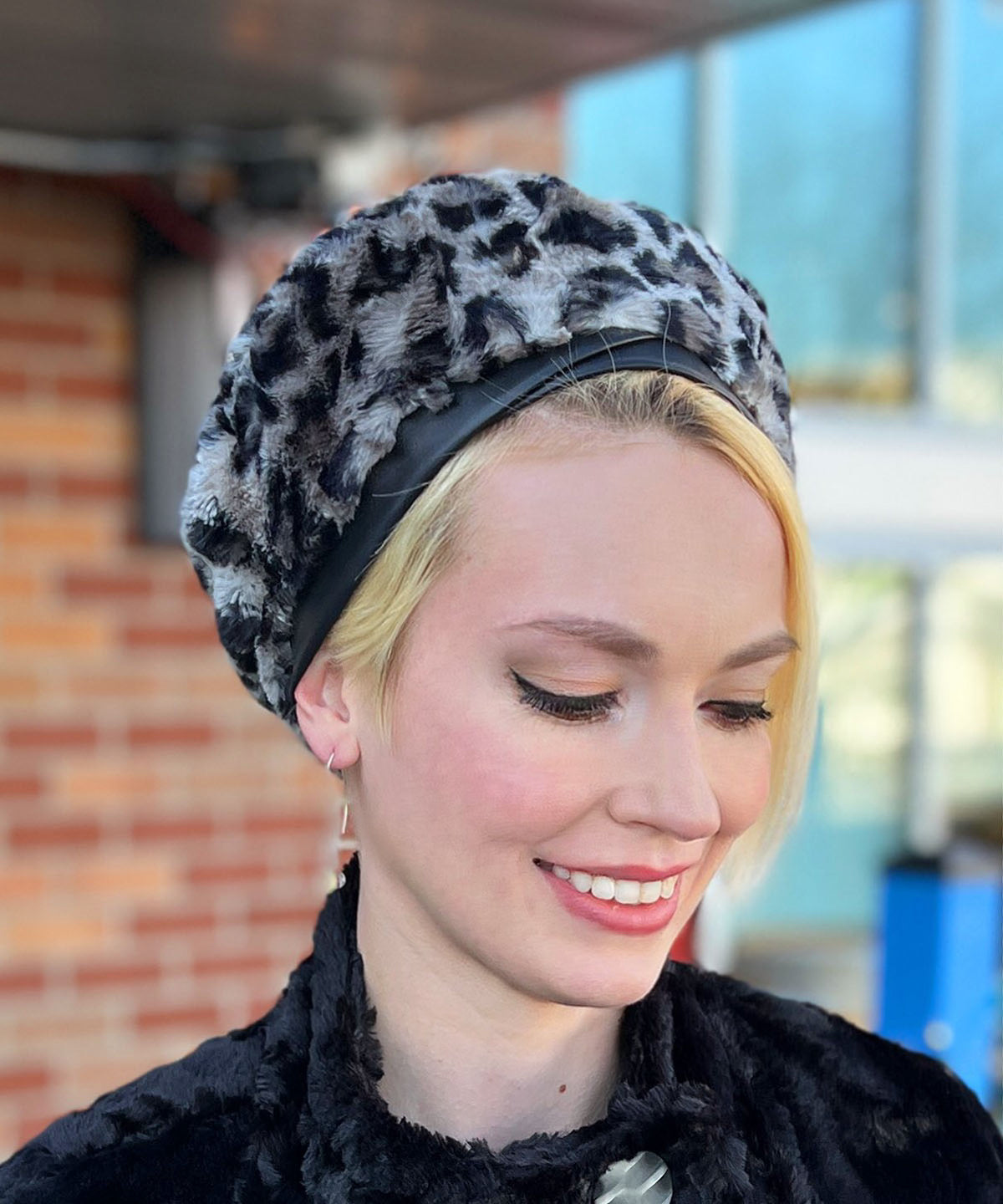 Model wearing Beret Hat in Savannah Cat Faux Fur close up Handmade by Pandemonium Seattle