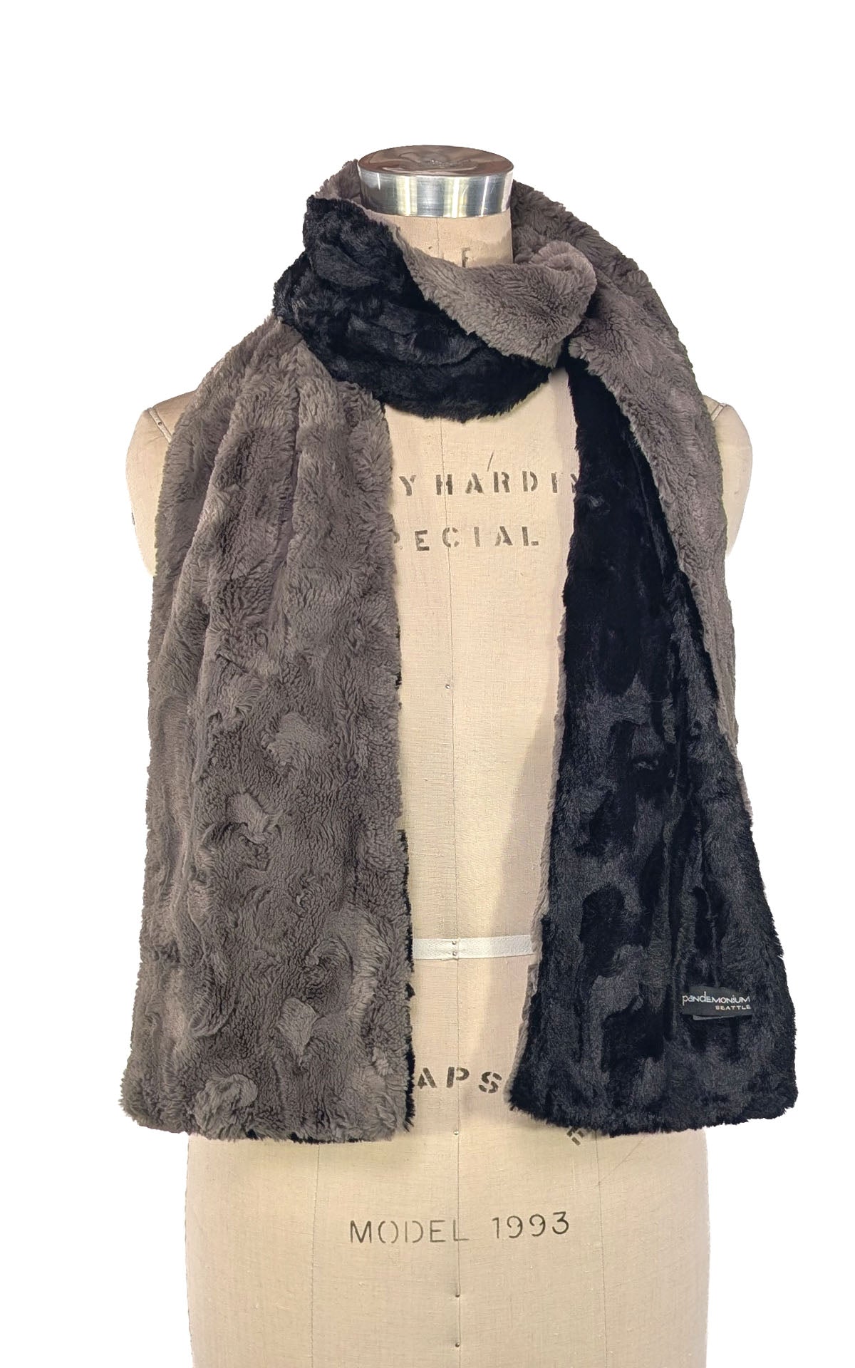 Classic Two-Tone Scarf in   Cuddly Taupey Faux Fur with Cuddly Black. Shown looped around neckline on mannequin. Made in Seattle, WA, USA by Pandemonium.