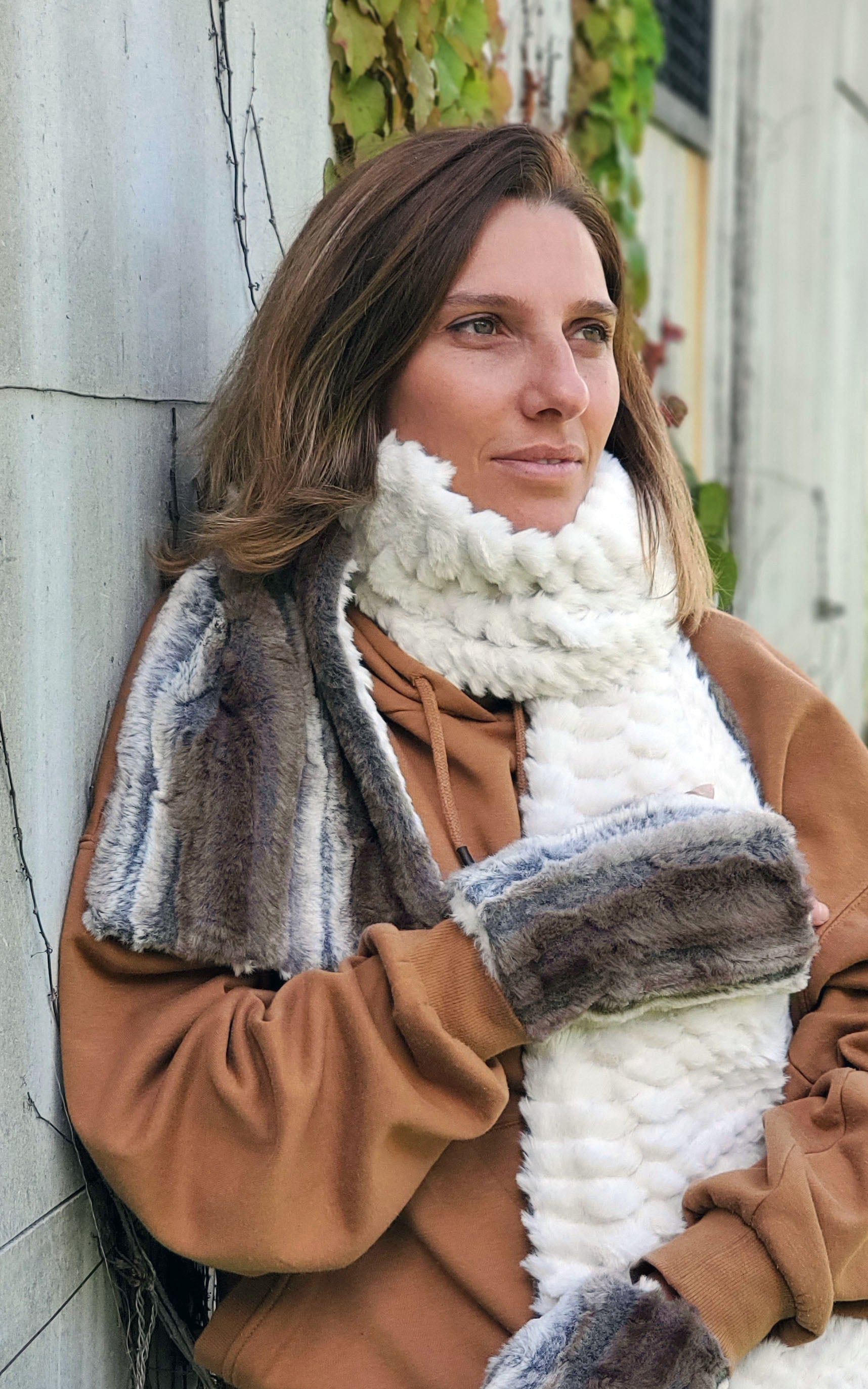 Model against wall wearing women's Classic Scarf and texting fingerless gloves | Willows Grove Plush Faux Fur with Falkor | Handmade in Seattle WA | Pandemonium Millinery