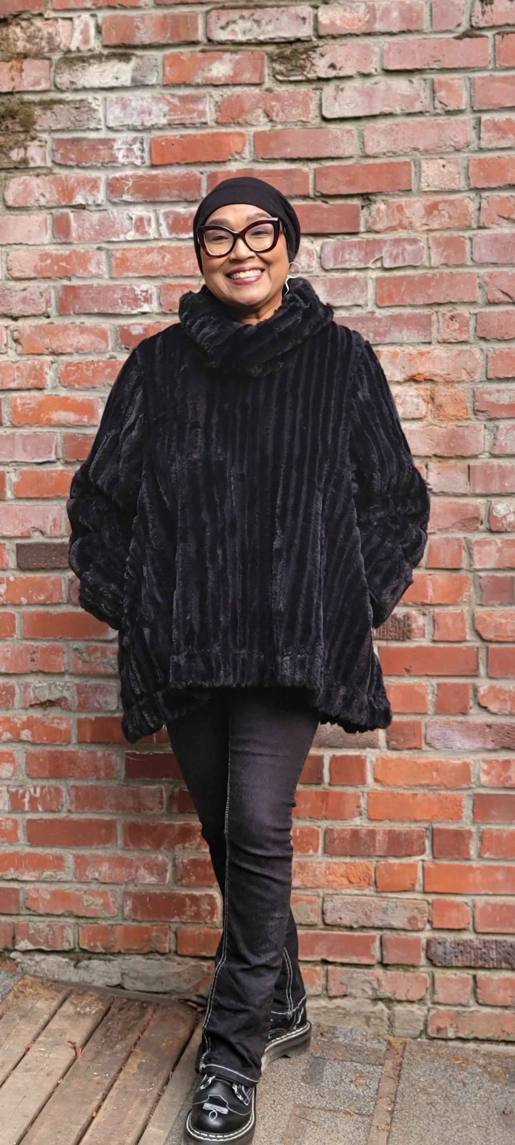 Woman wearing the Cowl Top Pullover in Cirrus Shadow, in a side view. Handmade by Pandemonium Seattle, in Seattle, WA, USA.
