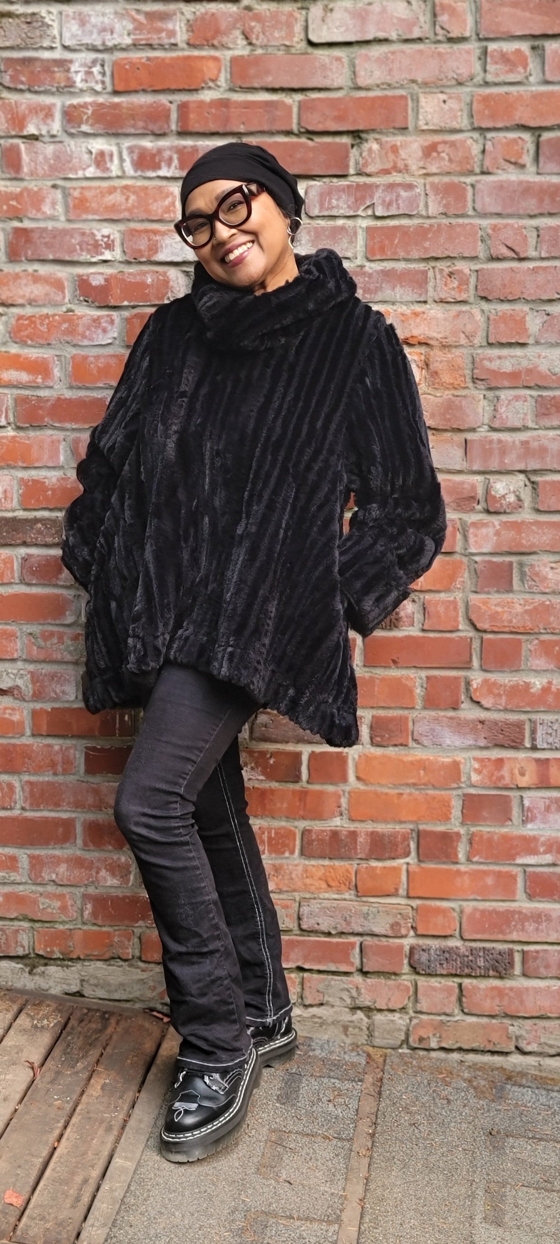 Woman wearing the Cowl Top Pullover in Cirrus Shadow, in a side view. Handmade by Pandemonium Seattle, in Seattle, WA, USA.
