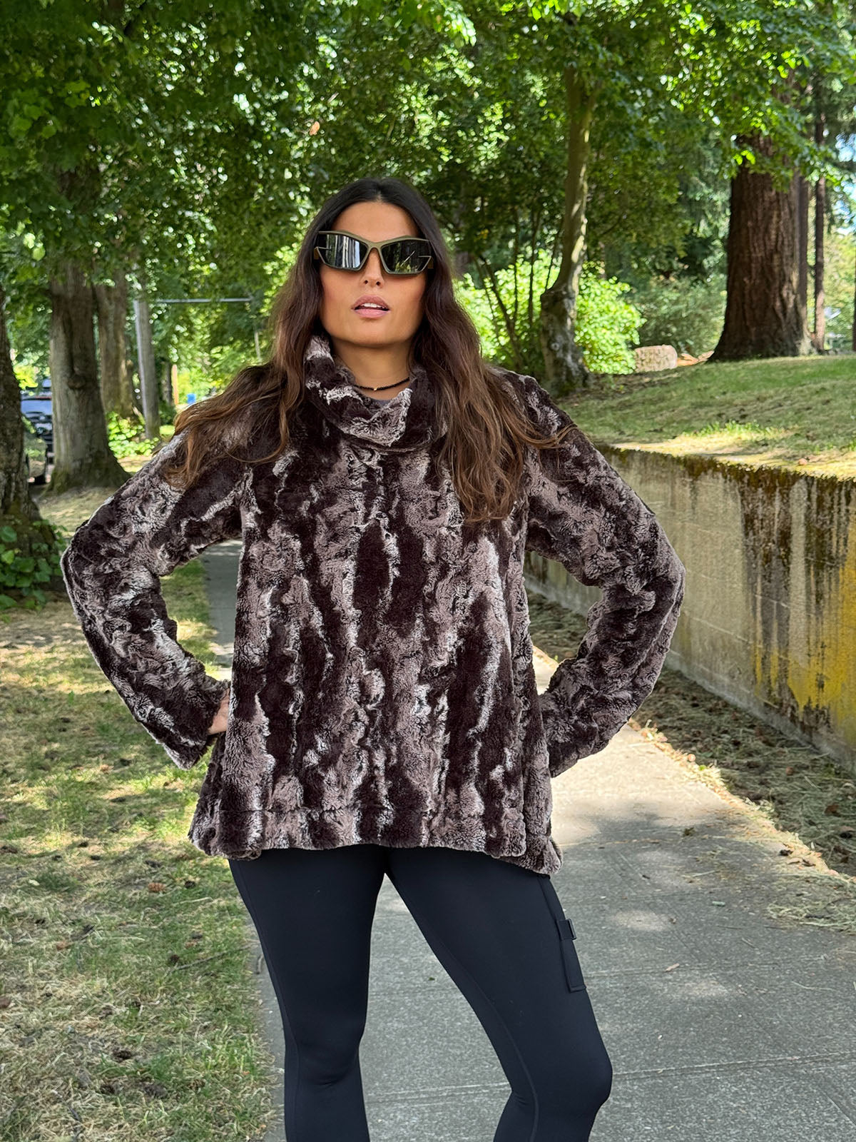 Woman wearing the Pandemonium Cowl Top Pullover in Mocha faux fur. Hand sewn in Seattle, WA by Pandemonium Seattle.