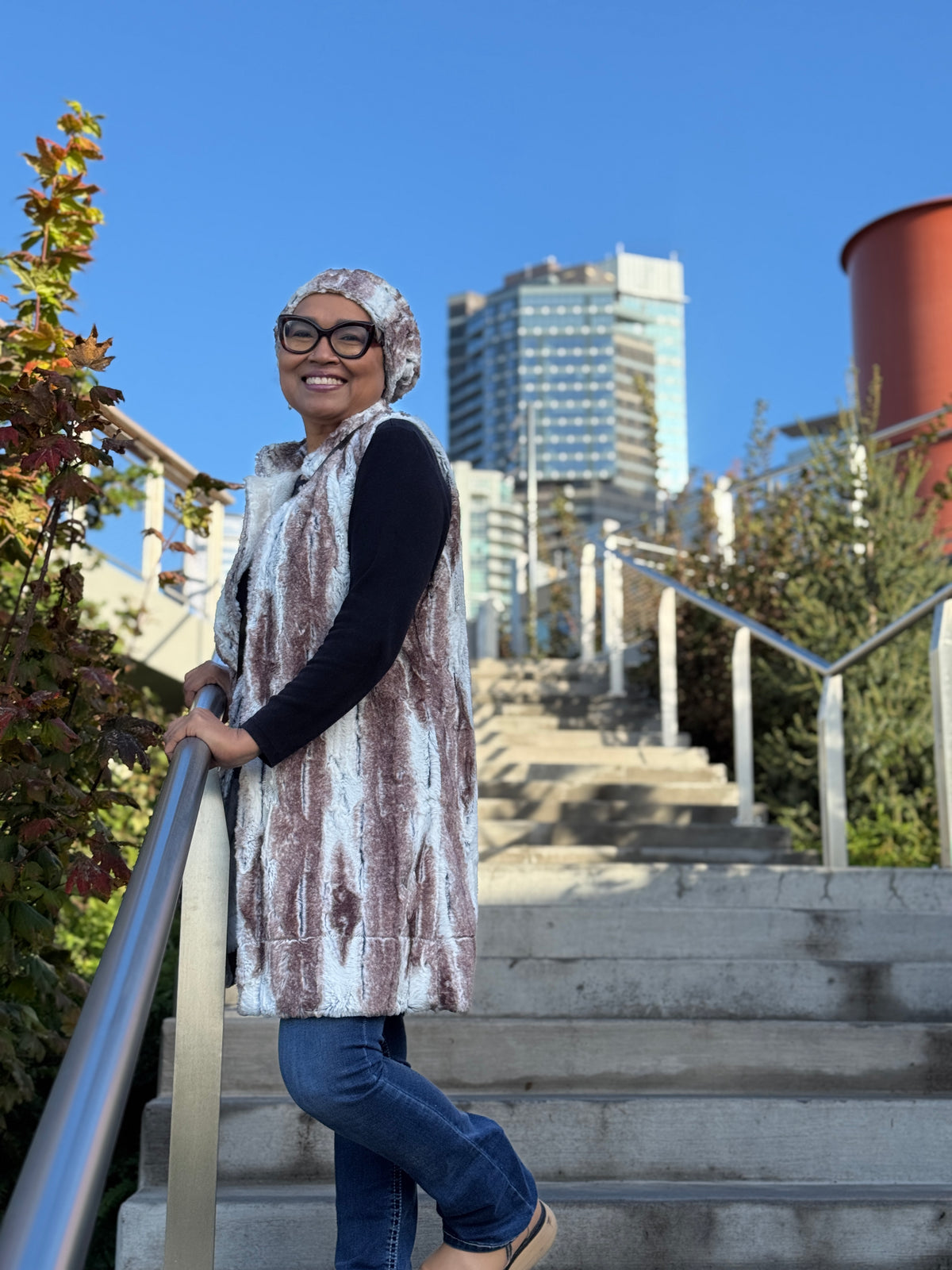 Woman wearing the Mandarin Vest in Birch with a matching Cuffed Pillbox hat. Handmade in Seattle, WA, USA by Pandemonium Millinery.
