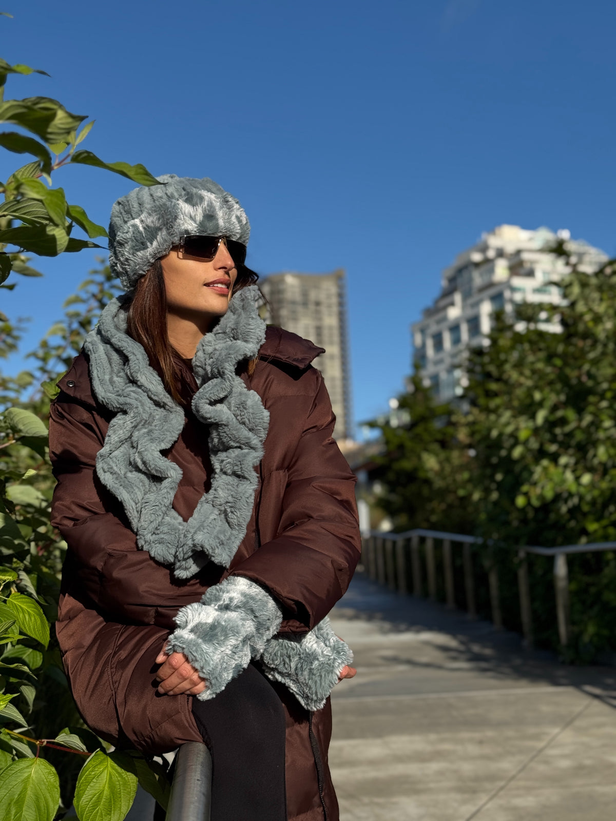 Woman wearing a Cloudwalk and Cirrus Blue Mist Cuffed Pillbox and a matching Scrunchy Scarf in Cirrus Blue Mist and Fingerless Gloves in Cloudwalk Blue Mist. Handmade in Seattle, WA, USA by Pandemonium Millinery.