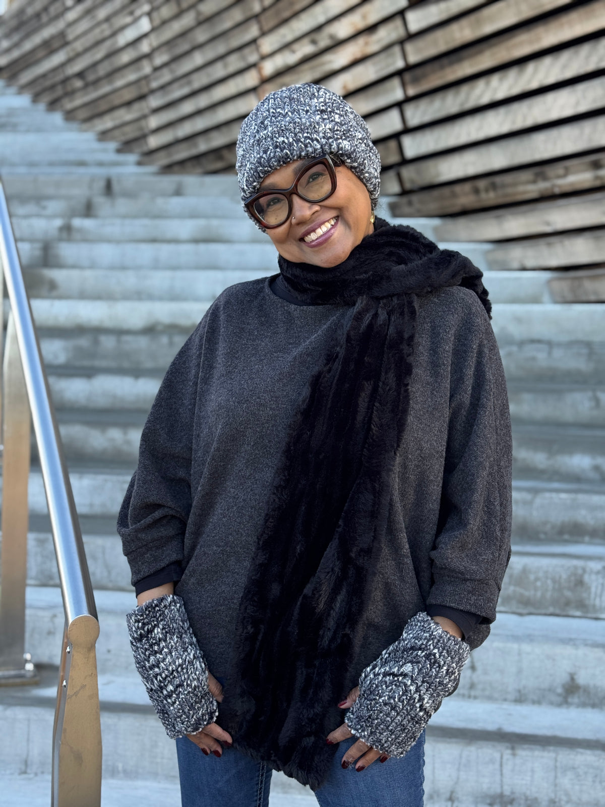 Woman wearing a Cuffed Pillbox in Cozy Cable Faux Fur with matching Fingerless Gloves and a Classic Scarf in Cirrus Shadow. Handmade in Seattle, WA, USA by Pandemonium Millinery.