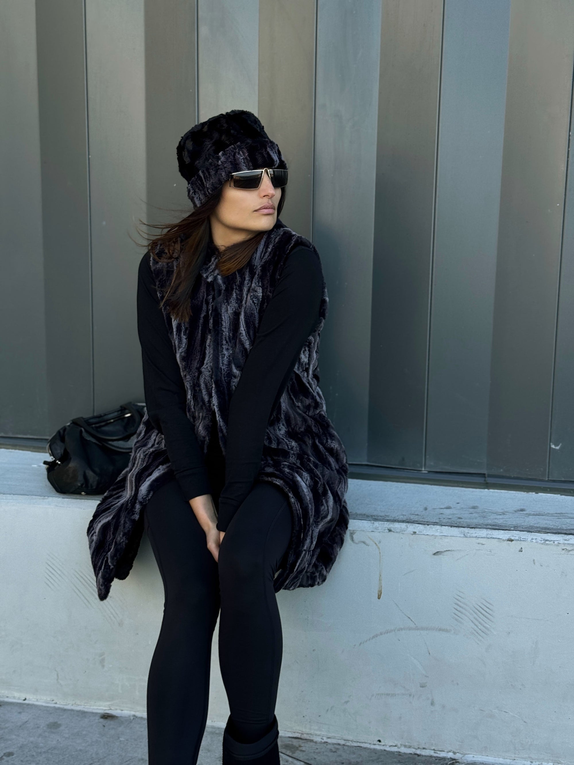 Woman wearing the Mandarin Vest in Black Marble with Cuddly Black and a matching Cuffed Pillbox in Black Marble and Cuddly Black. Handmade in Seattle, WA, USA by Pandemonium Millinery.