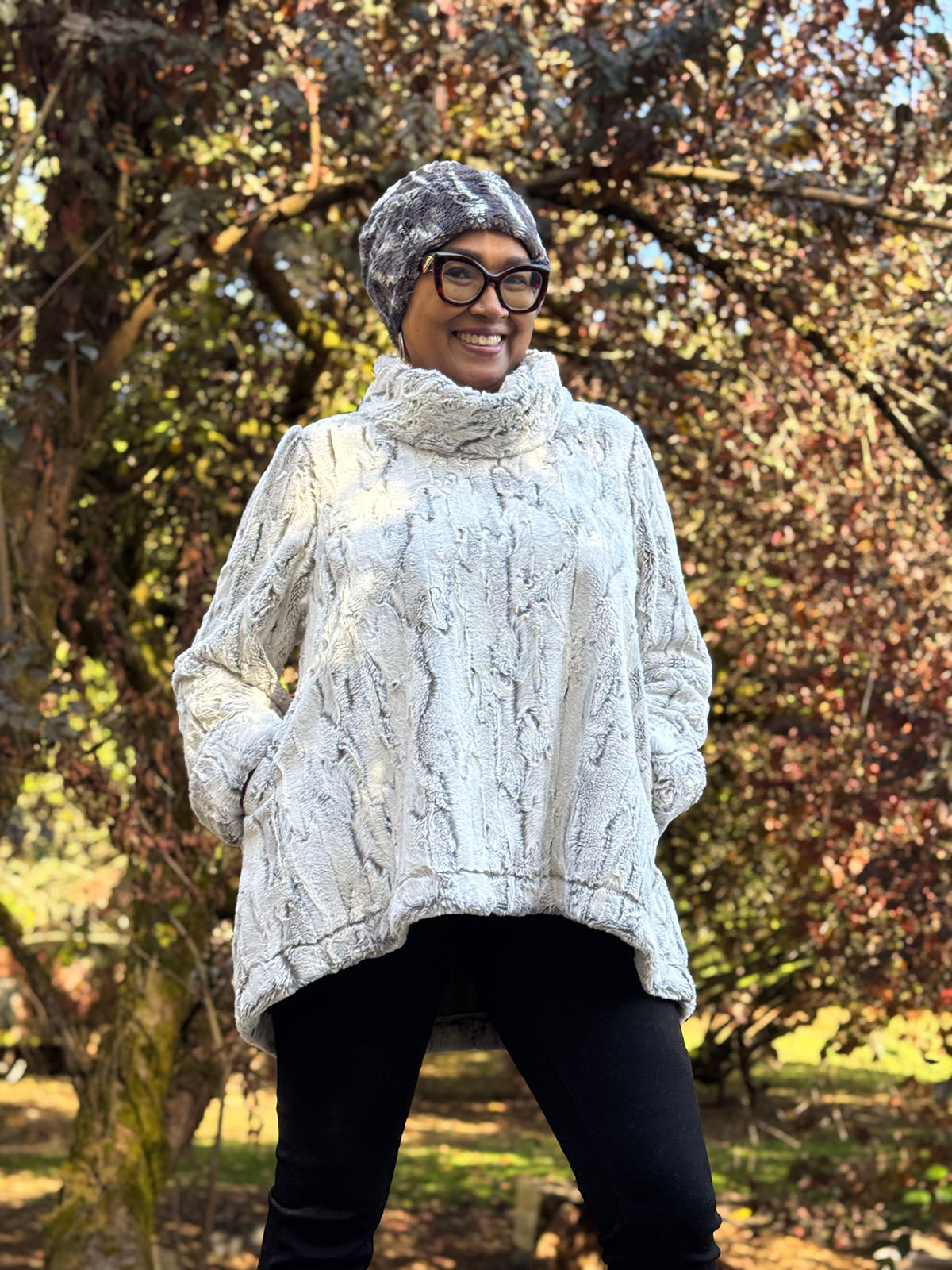 Woman wearing the Cowl Top Pullover in Khaki and a Cuffed Pillbox in Marble Dune Grey. Made in Seattle, WA, USA by Pandemonium Seattle.