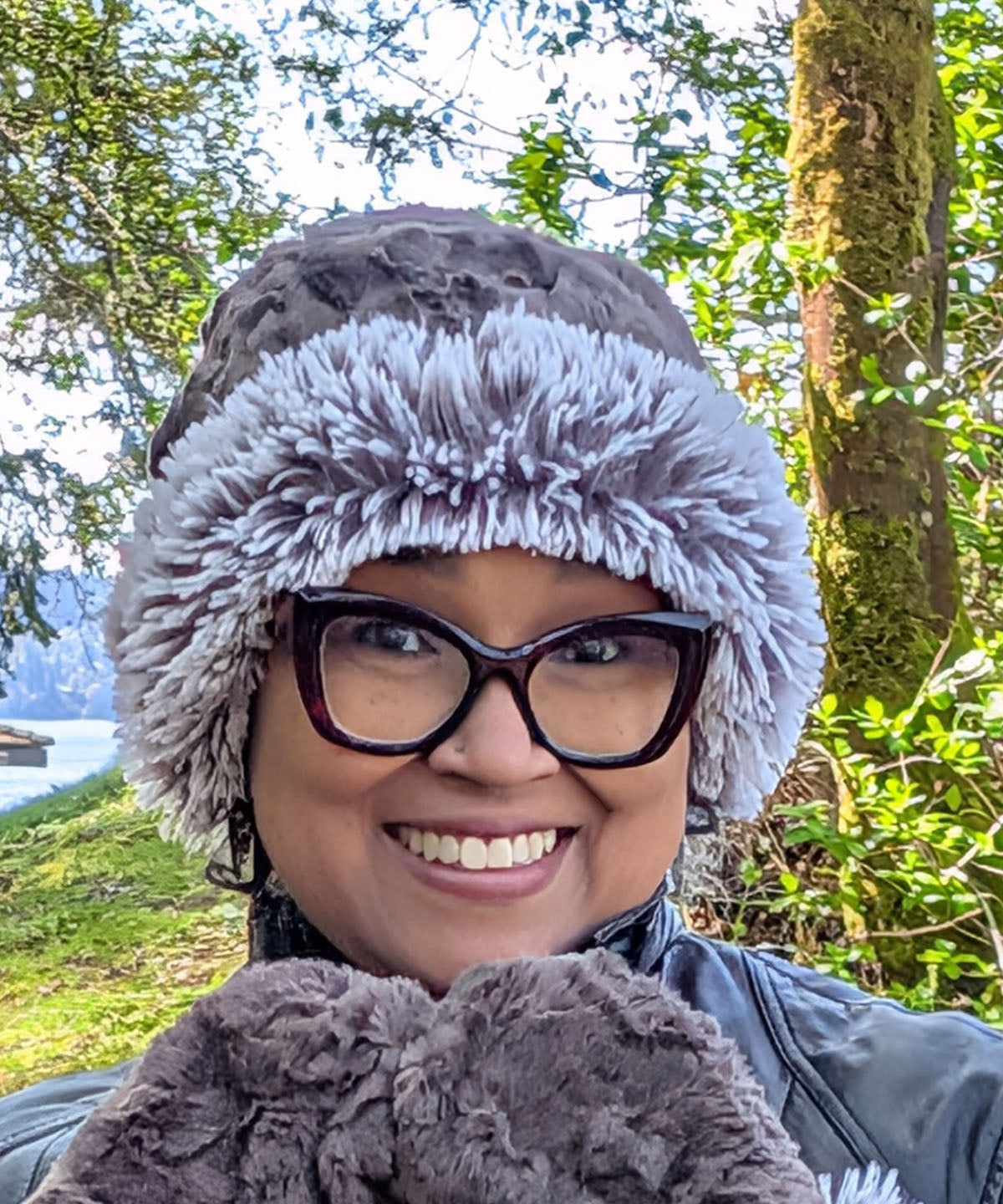 Woman wearing the Cuffed Pillbox in Cuddly Gray with Pearl Fox Cuff shown. Made in Seattle, WA, USA by Pandemonium Seattle.