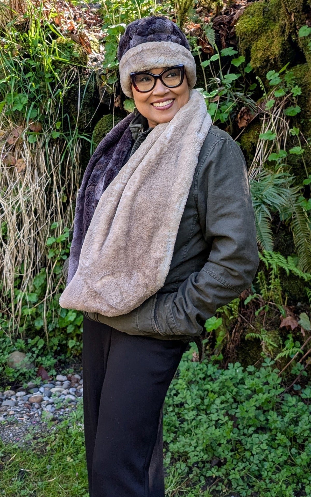 Woman wearing the Two-Tone Infinity Scarf in Coastal Plush Golden Bluff and Espresson Bean Faux Fur, with a matching Cuffed Pillbox Hat. Made in Seattle, WA, USA by Pandemonium Seattle.