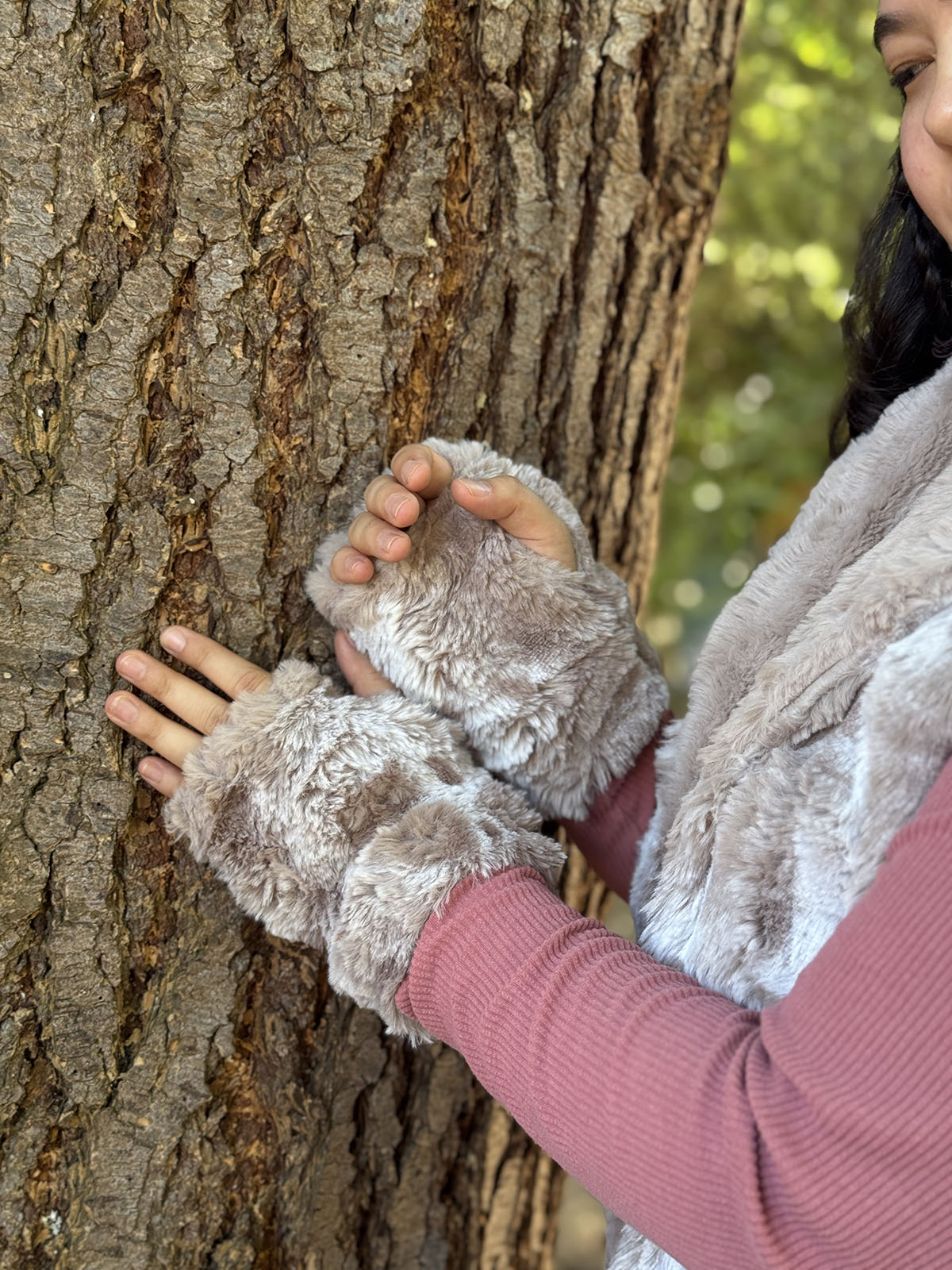 Close up of Cloudwalk in Honey Fingerless Gloves, displaying the faux fur texture. Hand sewn in Seattle, Washington by Pandemonium Seattle.