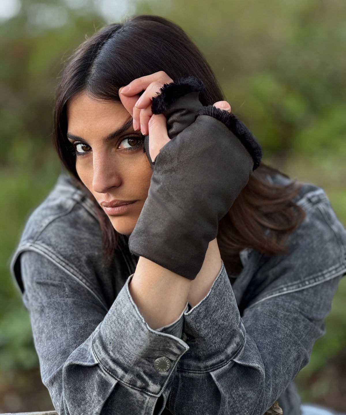 Woman with hands clasped together near face wearing Fingerless Gloves in Vegan Rustic Leather in Olive with short hair Luxury Faux Fur lining. Handmade in Seattle, WA, USA by Pandemonium  Millinery