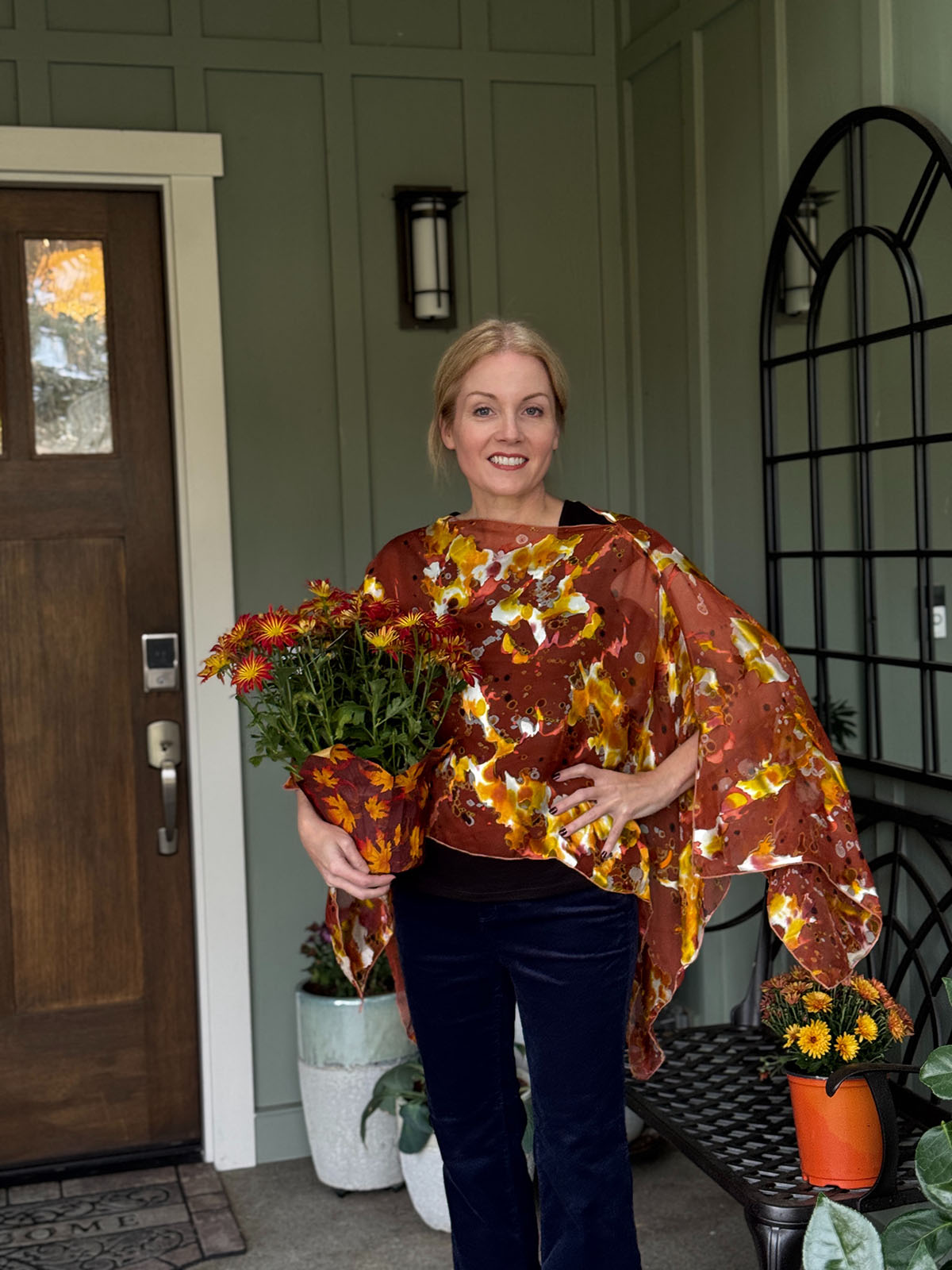 Woman wearing a Garden Path Silk Poncho in Snap Dragon. Made in Seattle, WA, USA by Pandemonium Millinery.