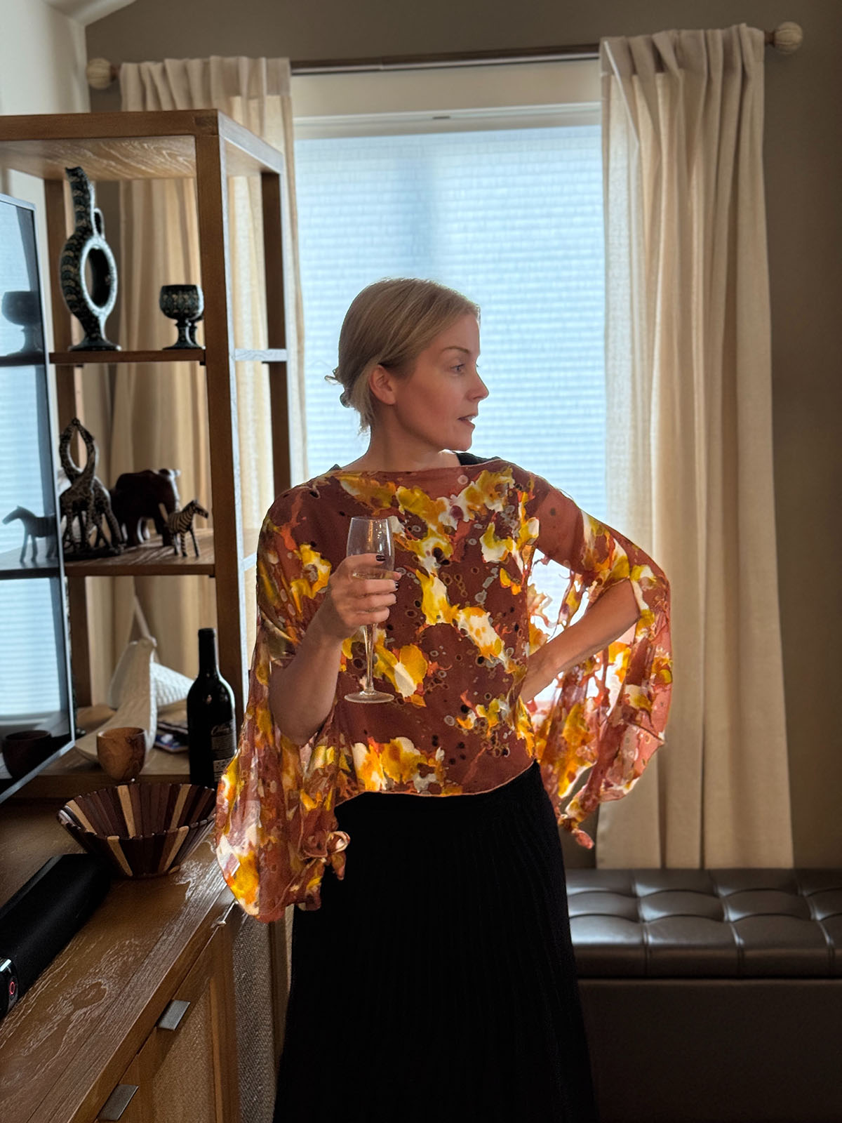 Woman wearing a Garden Path Silk Poncho in Snap Dragon. Made in Seattle, WA, USA by Pandemonium Millinery.