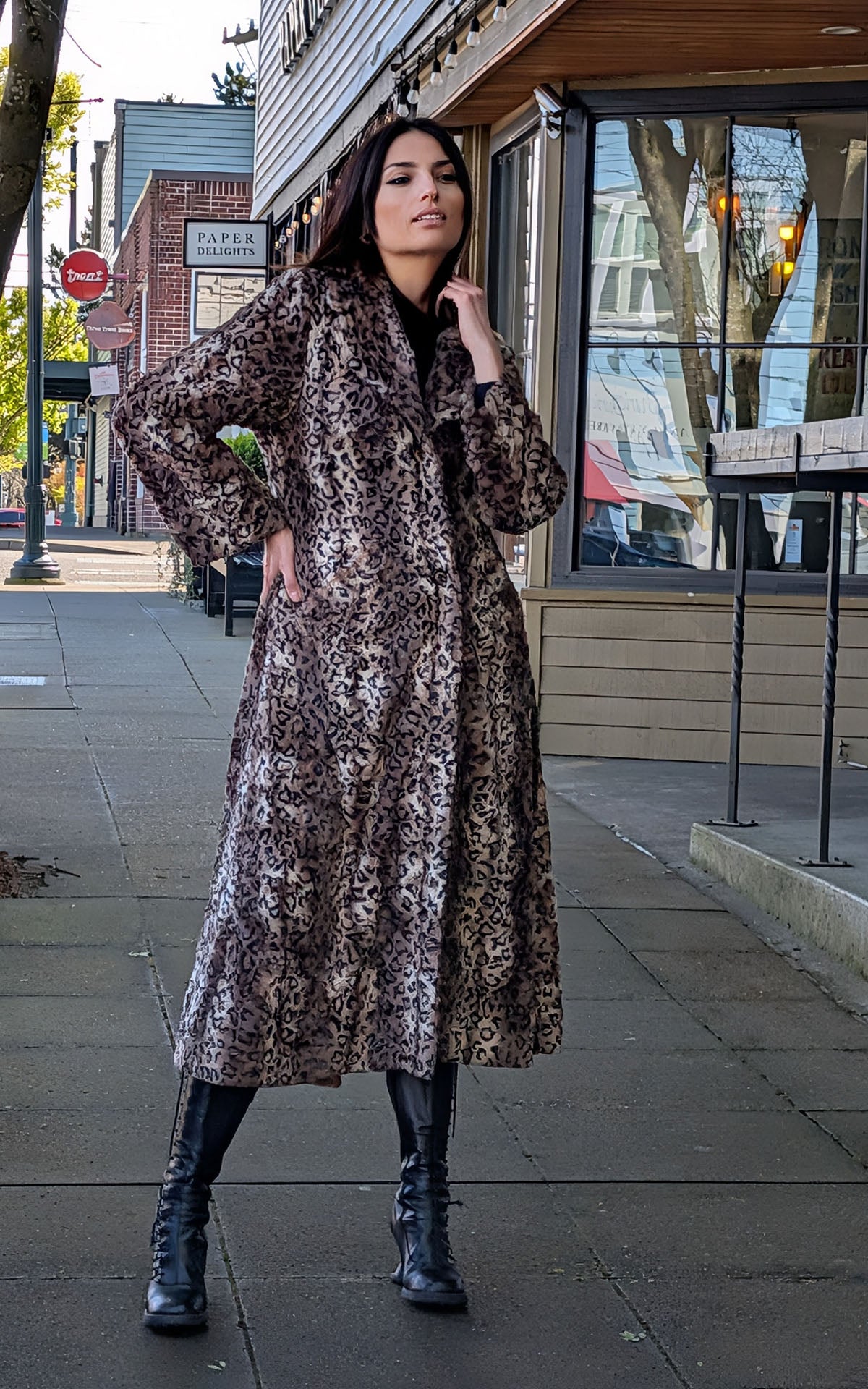 Model posing on sidewalk wearing the Hayworth Coat in Carpathian Lynx Faux Fur. Handsewn in Seattle WA, USA by Pandemonium Seattle