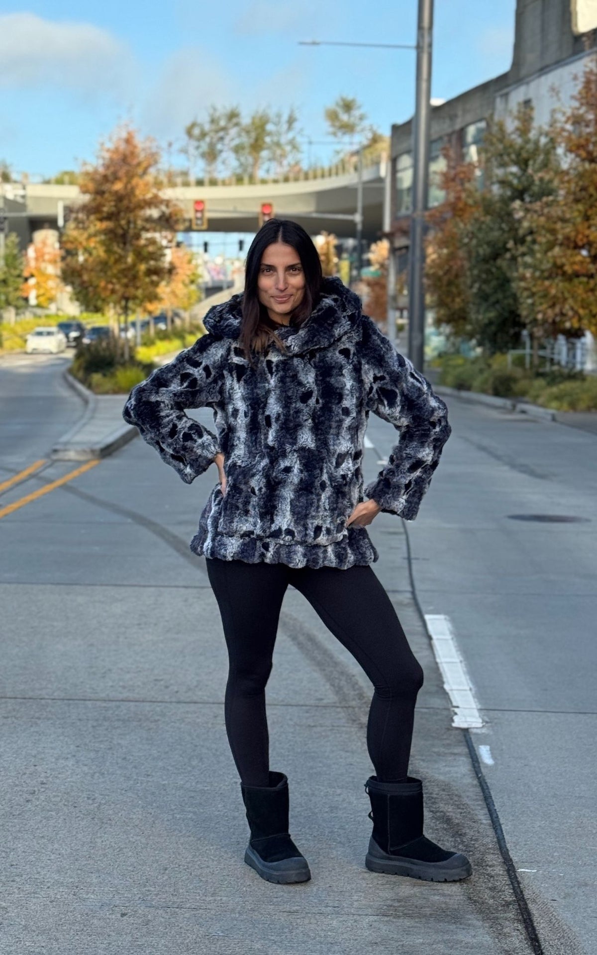 Woman wearing the Hooded Lounger in Cloudwalk Shadow with the hood down. Hand sewn in Seattle, WA by Pandemonium Seattle.