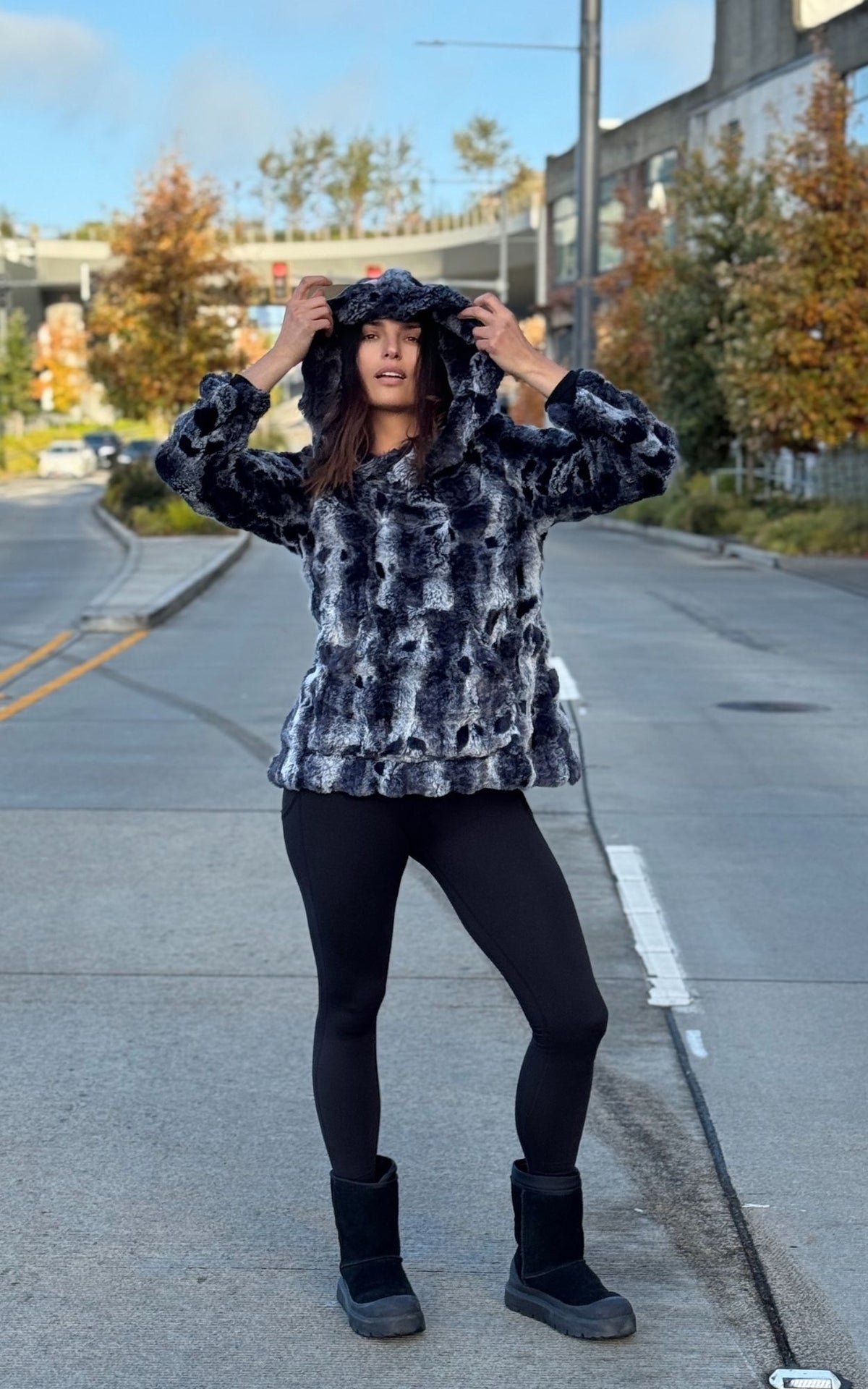 Woman wearing the Hooded Lounger in Cloudwalk Shadow with the hood up. Hand sewn in Seattle, WA by Pandemonium Seattle.