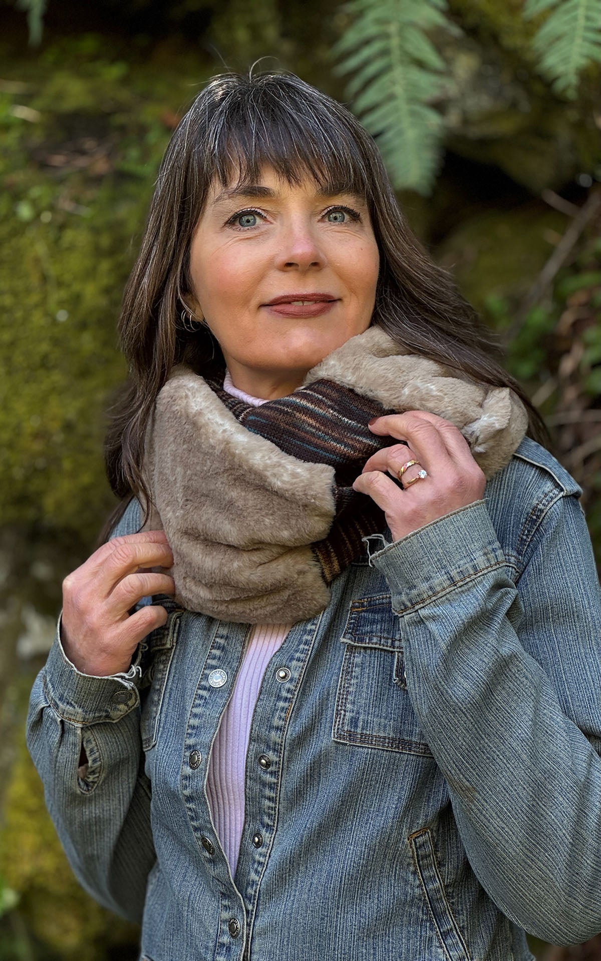 Woman wearing the Sweet Stripes Infinity Scarf in English Toffee and Golden Bluff, shown looped twice around her neckline. Made in Seattle, WA, USA by Pandemonium Seattle.
