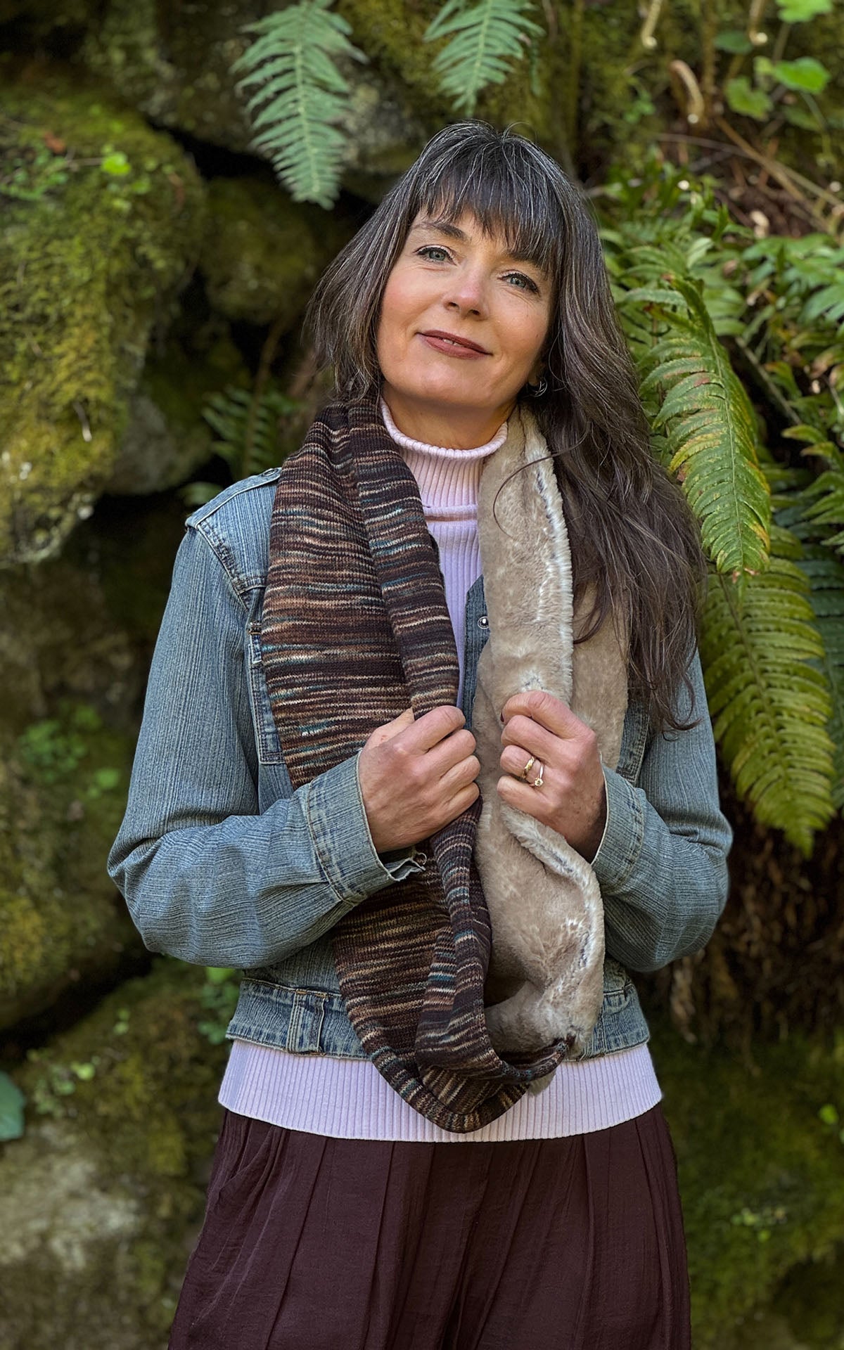 Woman wearing the Sweet Stripes Infinity Scarf in English Toffee and Golden Bluff, shown draped loosely around her neckline. Made in Seattle, WA, USA by Pandemonium Seattle.