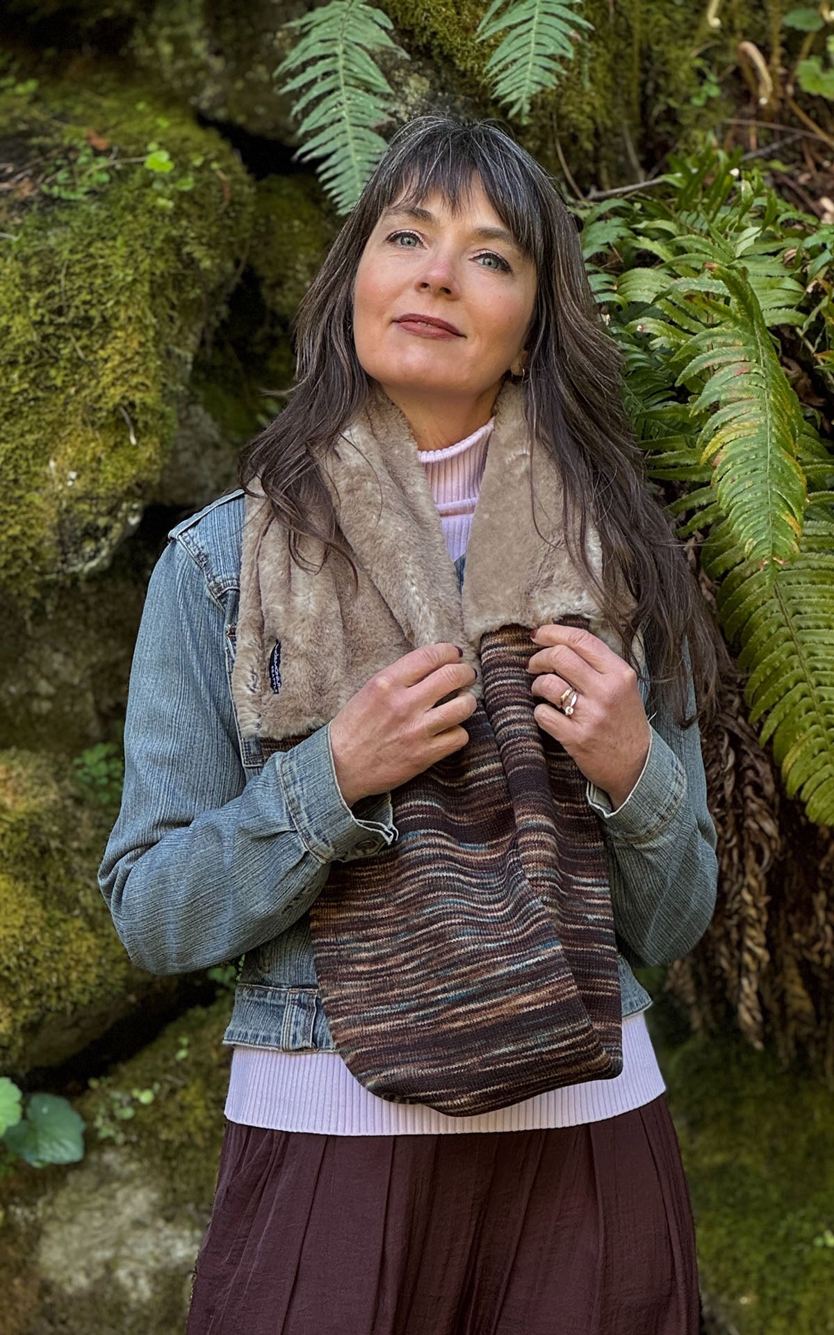 Woman wearing the Sweet Stripes Infinity Scarf in English Toffee and Golden Bluff, shown draped with the Golden Bluff side at the neckline. Made in Seattle, WA, USA by Pandemonium Seattle.